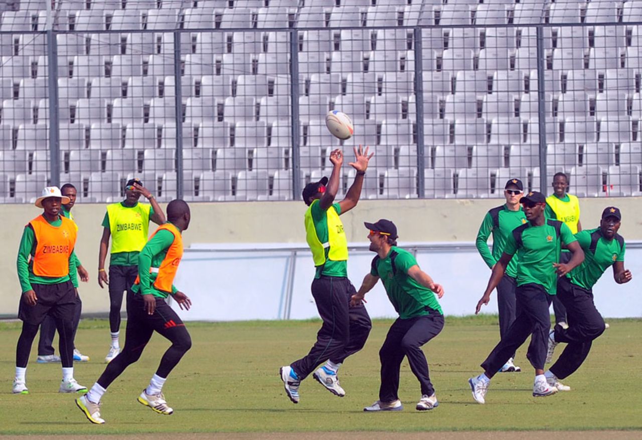 Zimbabwe's players try their hand at rugby during a training session, Mirpur, November 25, 2014