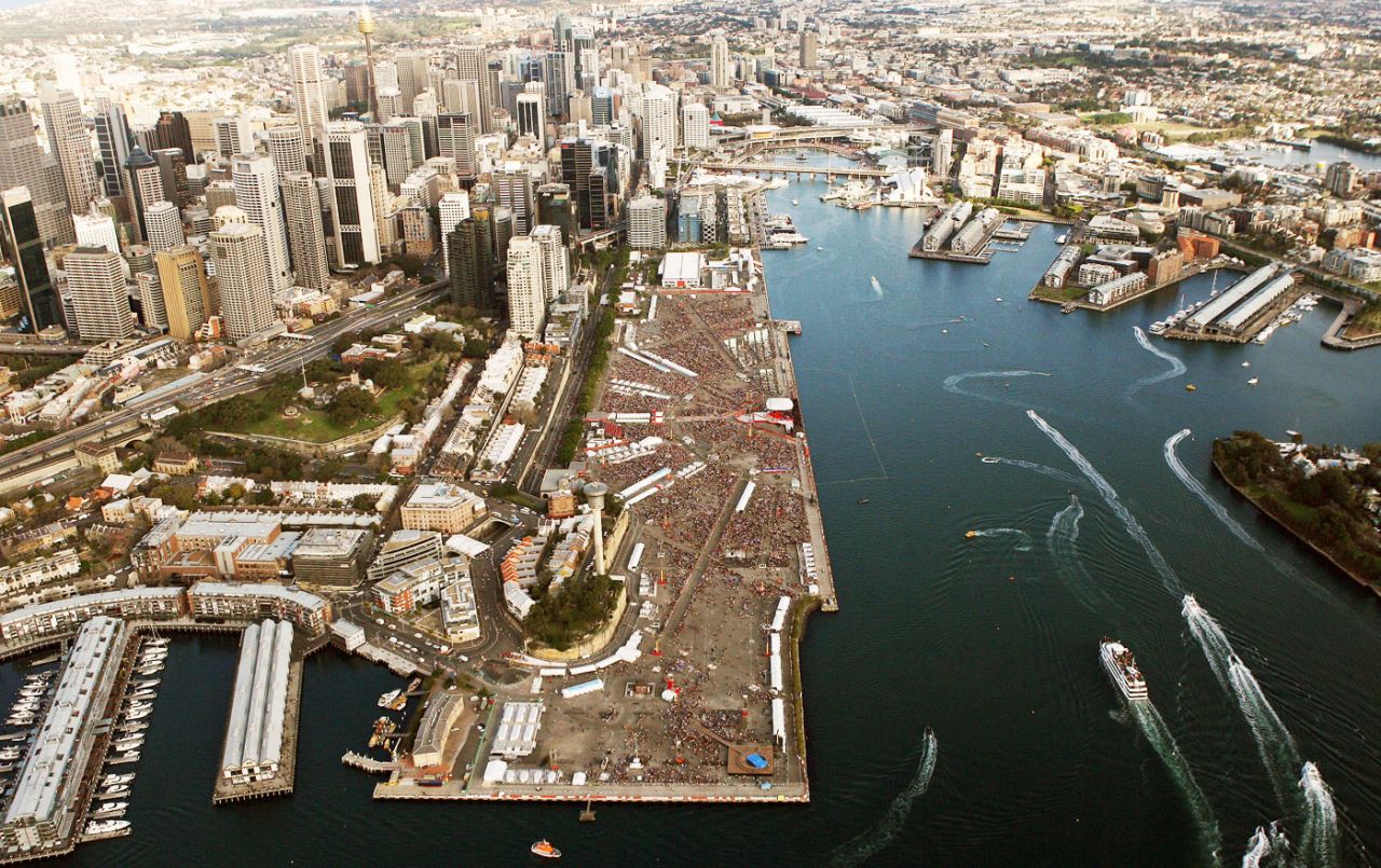 Thousands of pilgrims, center, pack into a harbour-side park to hear Pope Benedict XVI speak, July 17, 2008