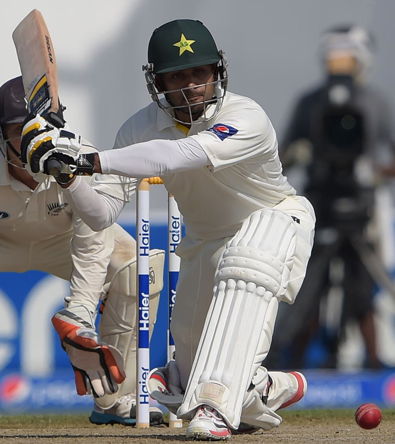 Mohammad Hafeez gets ready to sweep, Pakistan v New Zealand, 3rd Test, Sharjah, 1st day, November 26, 2014