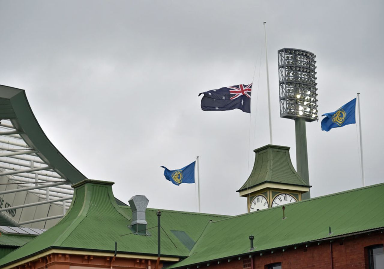 The Australian flag flies at half mast at the Sydney Cricket Ground, following the death of Phillip Hughes, November 27, 2014