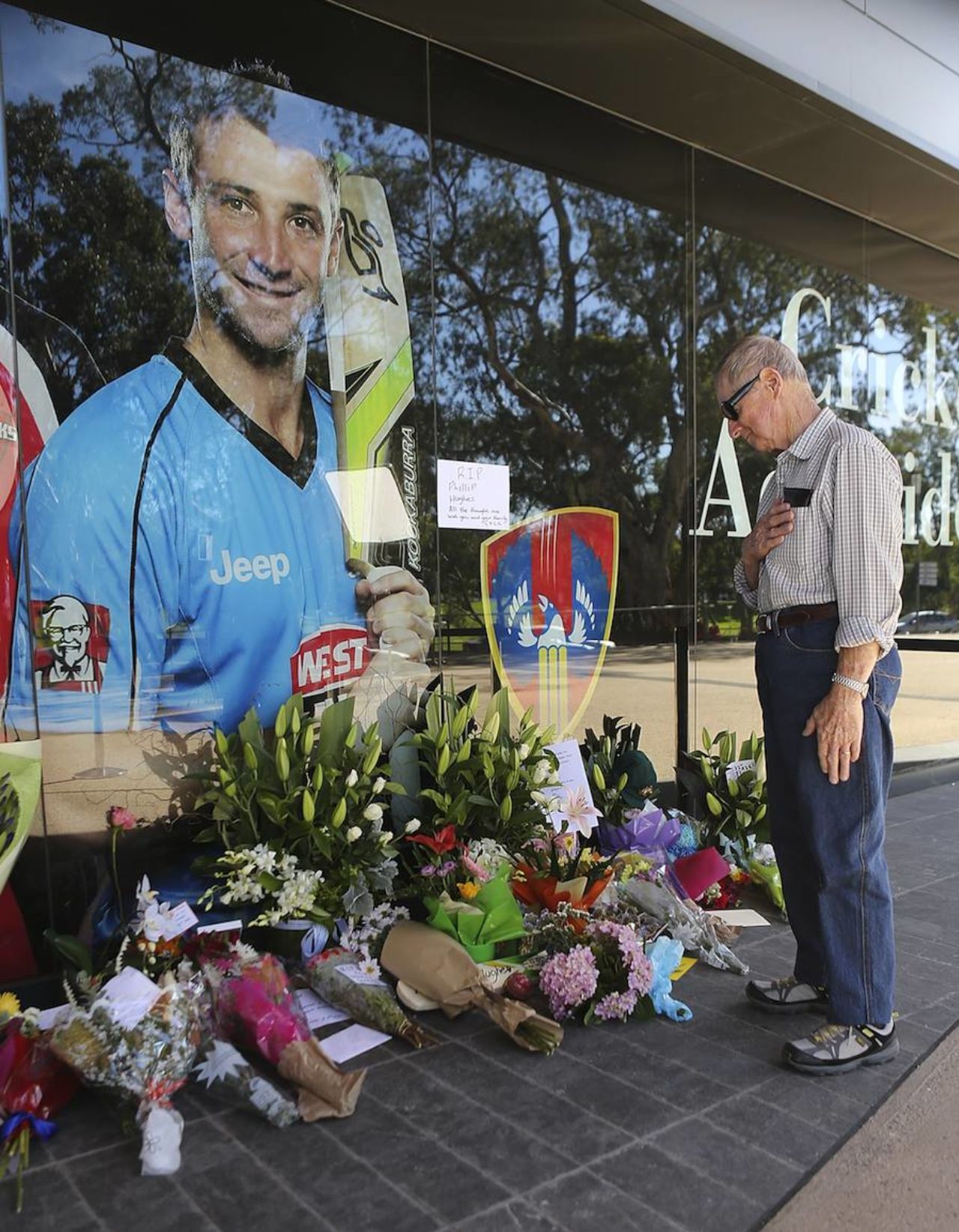 A man plays tribute to Phillip Hughes at the Adelaide Oval, November 28, 2014