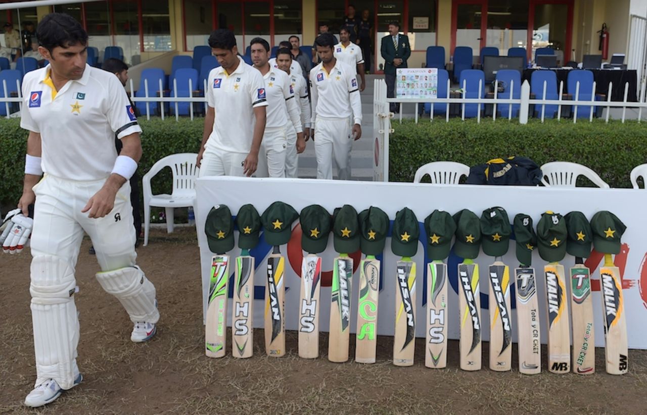 Misbah-ul-Haq walks past the lined-up bats, Pakistan v New Zealand, 3rd Test, Sharjah, 2nd day, November 28, 2014