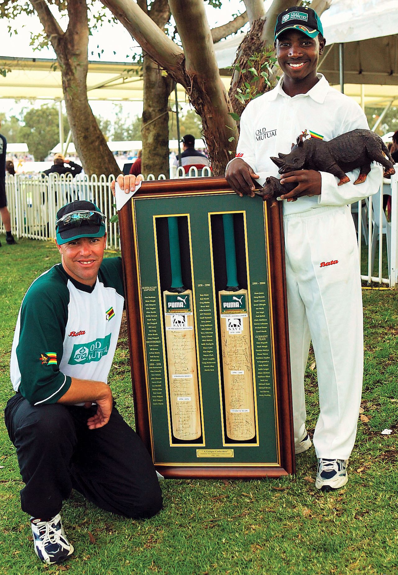 Heath Streak and Tatenda Taibu with bats signed by acurrent and former Australian cricketers to be auctioned to raise money to save the Black Rhino, Chairman's XI v Zimbabweans, Lilac Hill, Perth, October 1, 2003