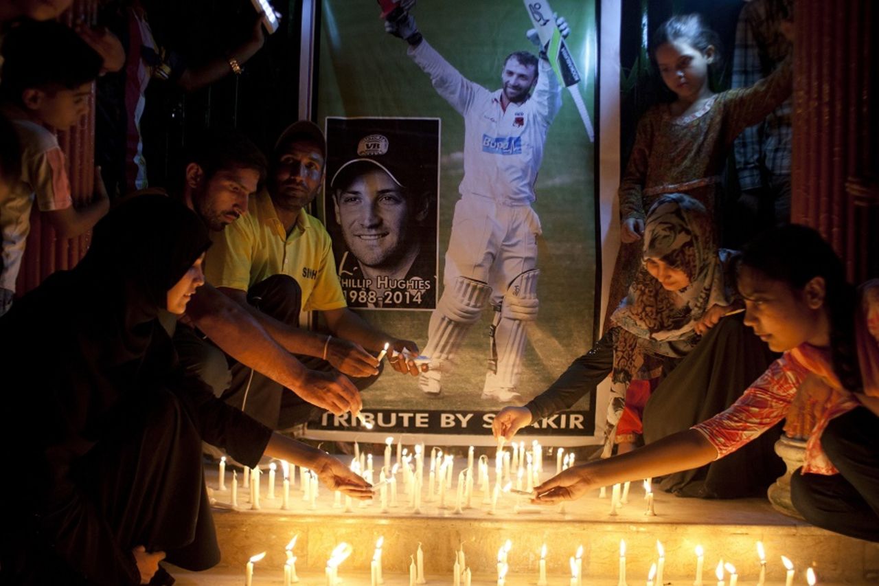 Candles are lit to pay tribute to Phillip Hughes in Karachi, Karachi, November 27, 2014