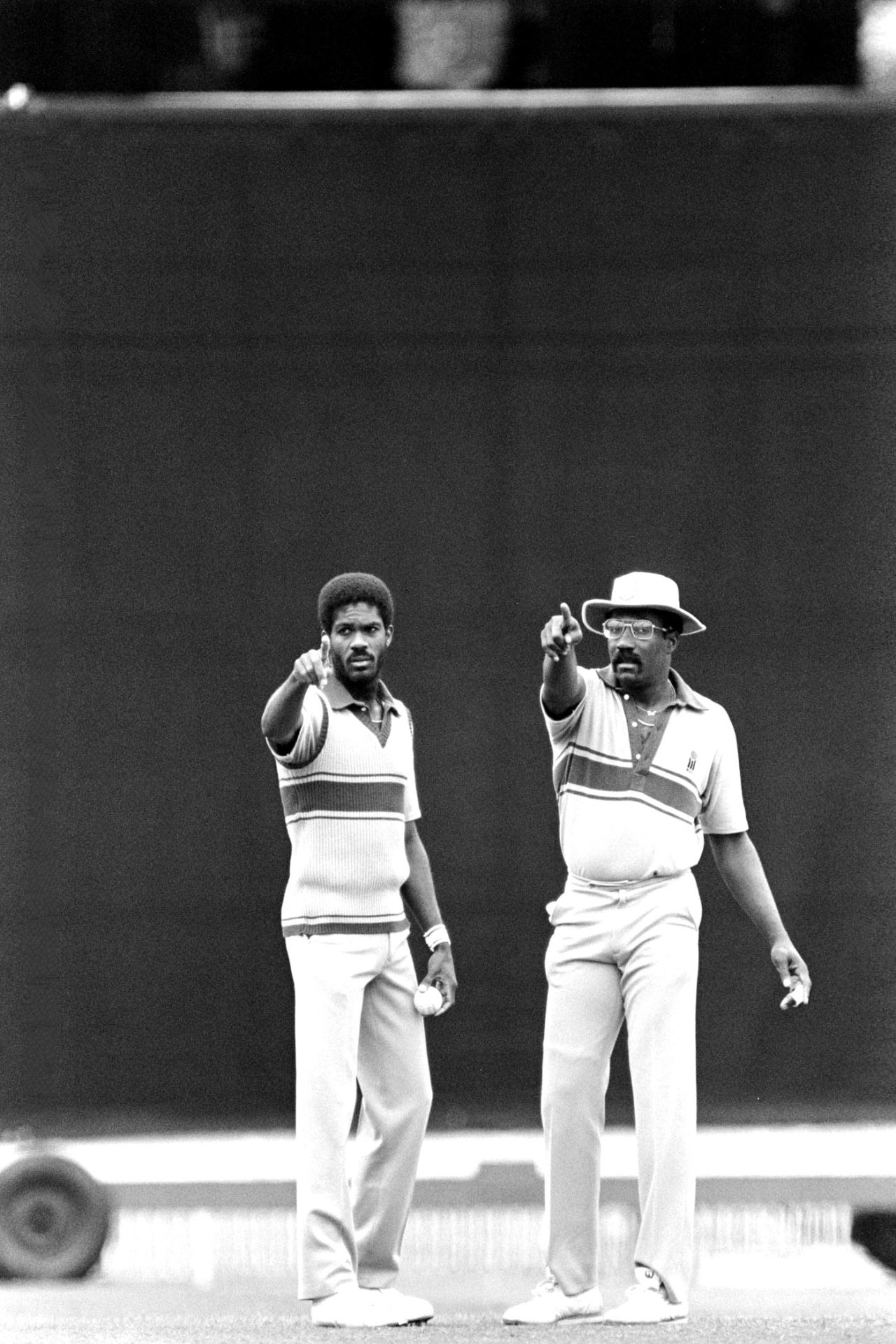 Michael Holding and Clive Lloyd set the field, Benson & Hedges World Championship, February 1985