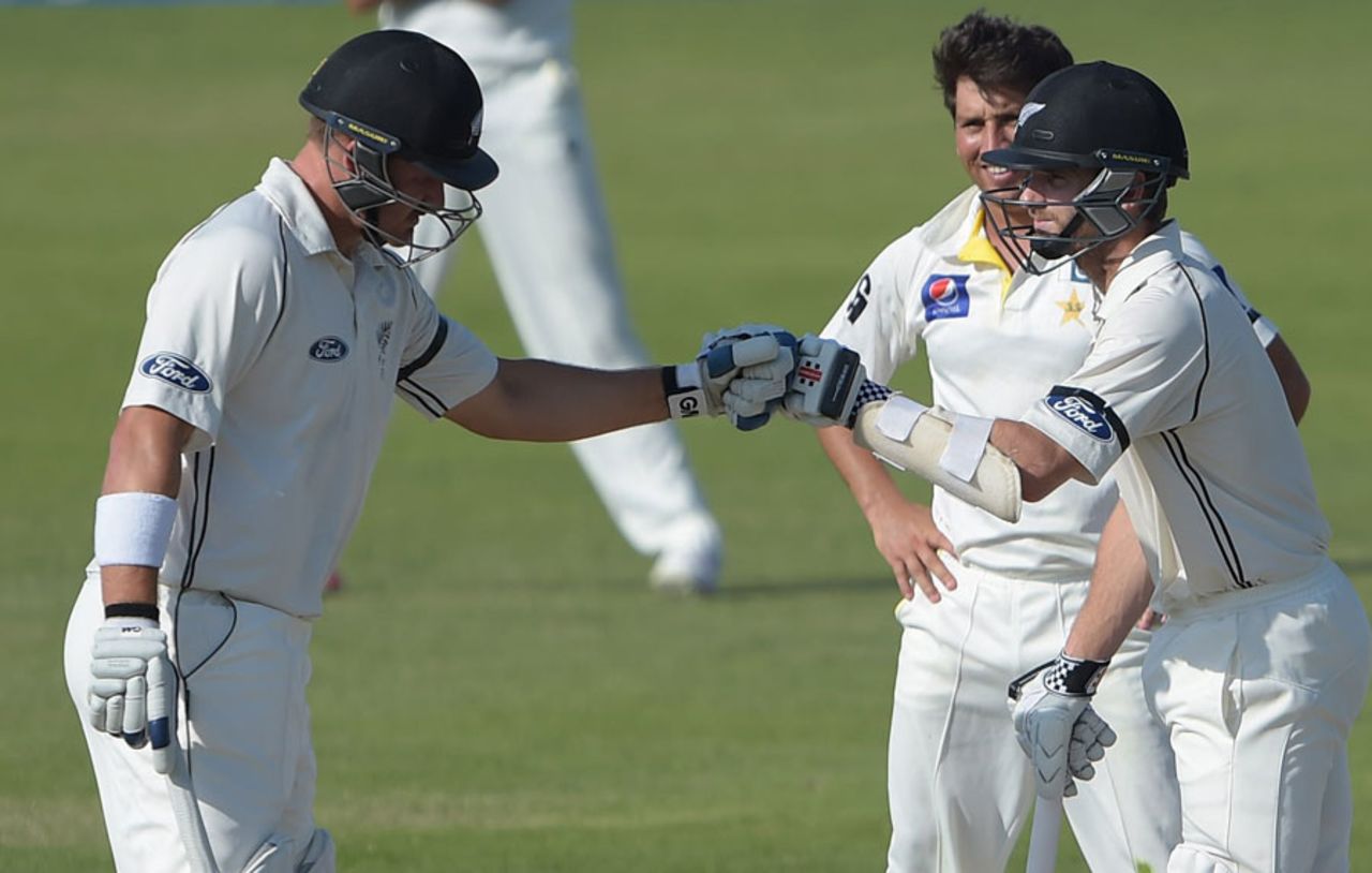 Kane Williamson and Corey Anderson punch gloves, Pakistan v New Zealand, 3rd Test, Sharjah, 3rd day, November 29, 2014