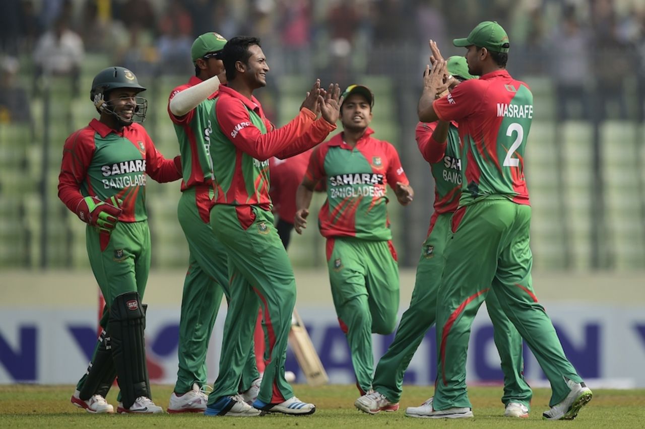 Shakib Al Hasan is congratulated after a wicket, Bangladesh v Zimbabwe, 5th ODI, Mirpur, December 1, 2014