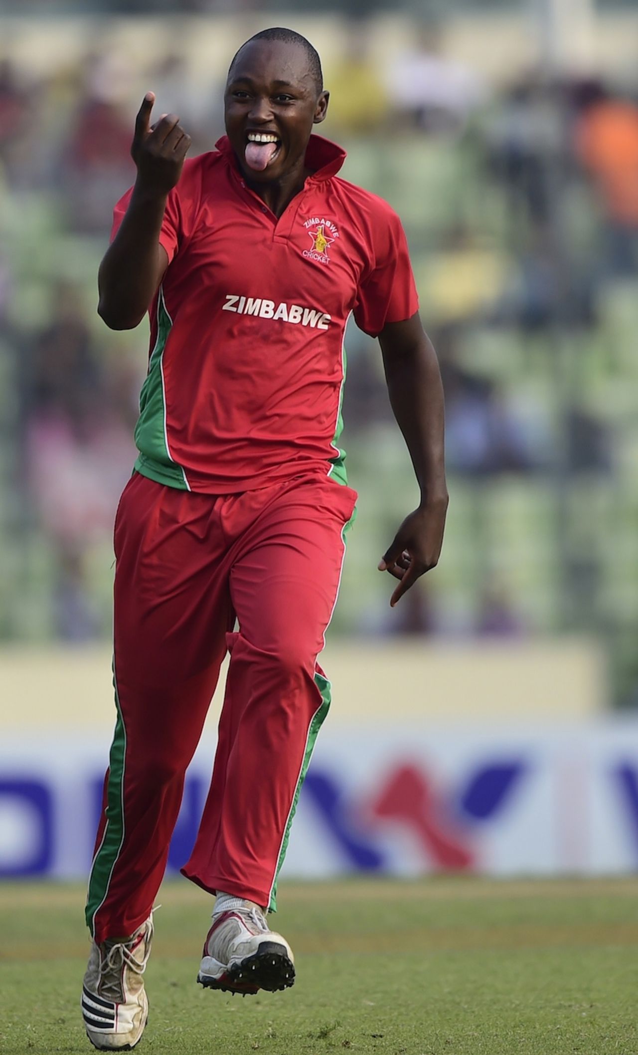 Tendai Chatara is all smiles after a wicket, Bangladesh v Zimbabwe, 5th ODI, Mirpur, December 1, 2014
