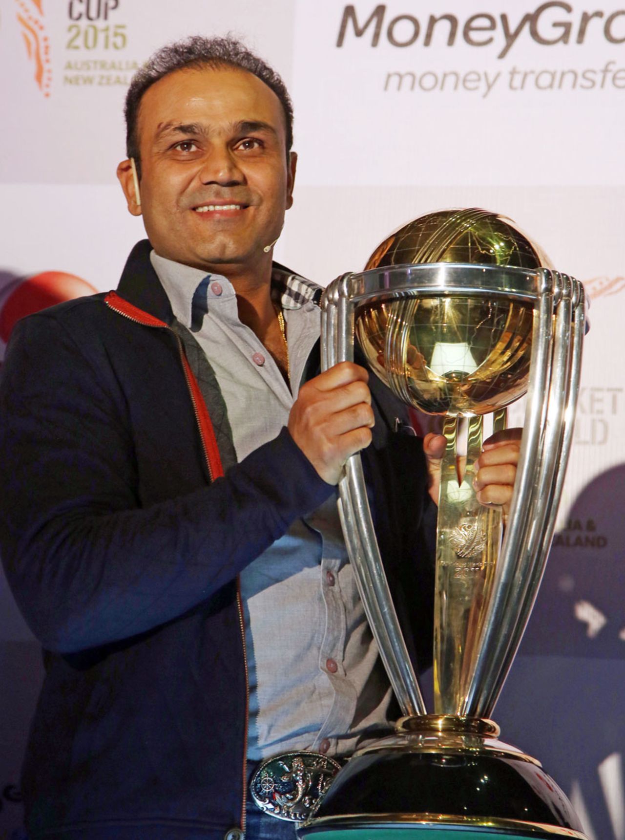 Virender Sehwag poses with the World Cup Trophy at a promotional event, Mumbai, December 2, 2014