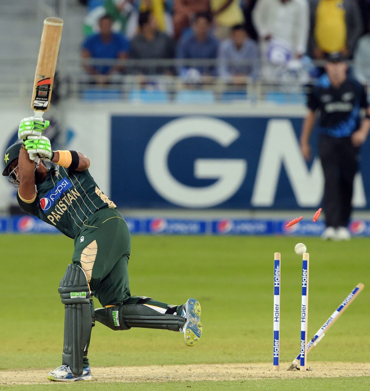 Umar Akmal was bowled by Jimmy Neesham, Pakistan v New Zealand, 2nd T20I, Dubai, December 5, 2014