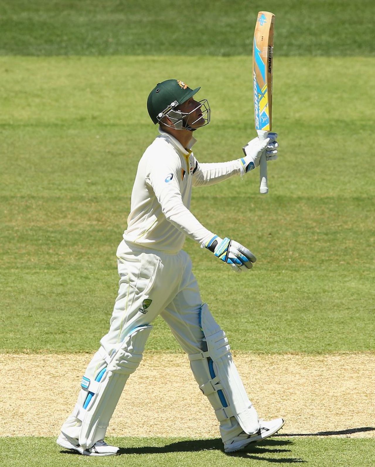Michael Clarke acknowledges the cheers on reaching fifty, Australia v India, 1st Test, Adelaide, 1st day, December 9, 2014