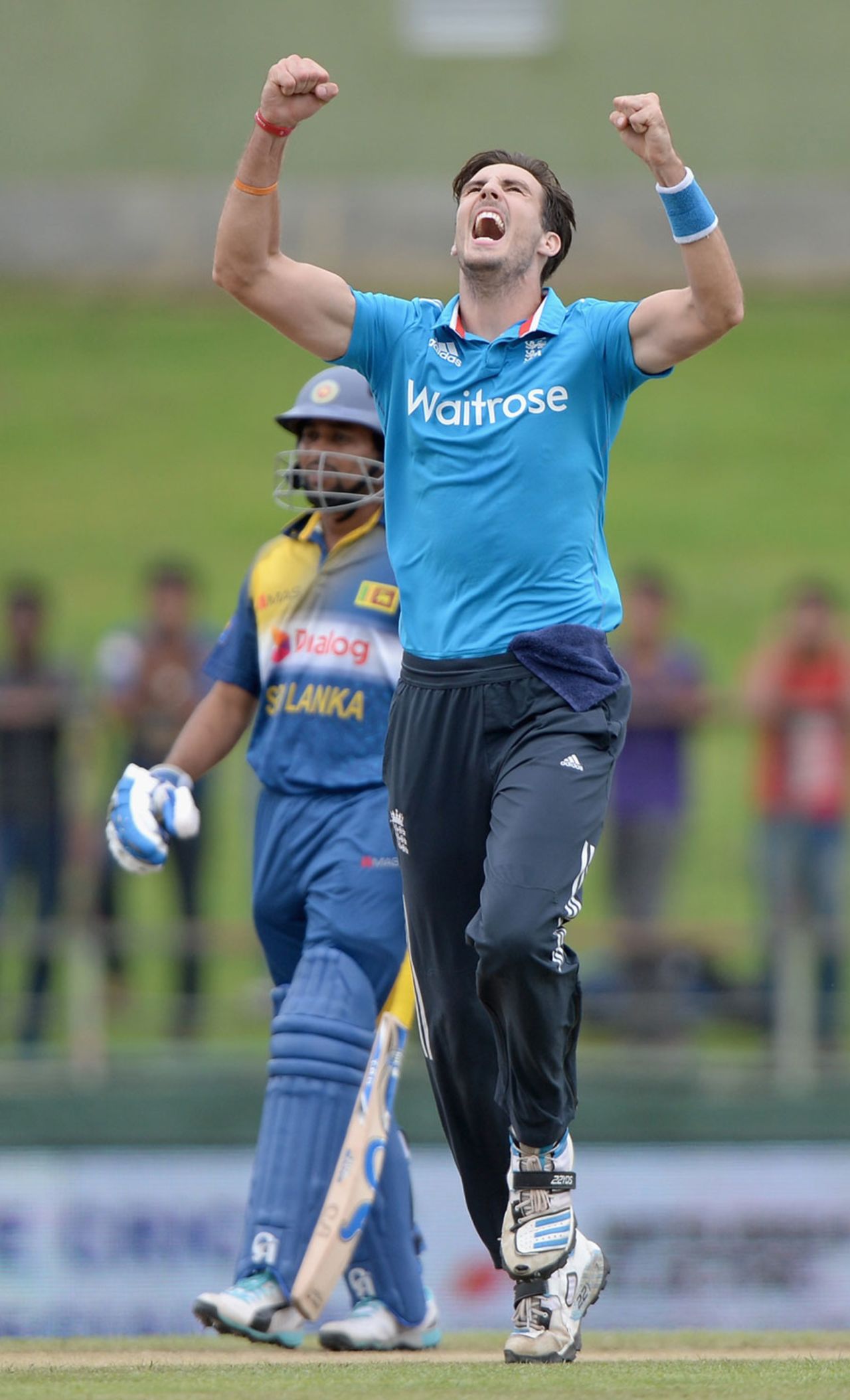 Steven Finn celebrates picking up a wicket in his first over, Sri Lanka v England, 5th ODI, Pallekele, December 10, 2014
