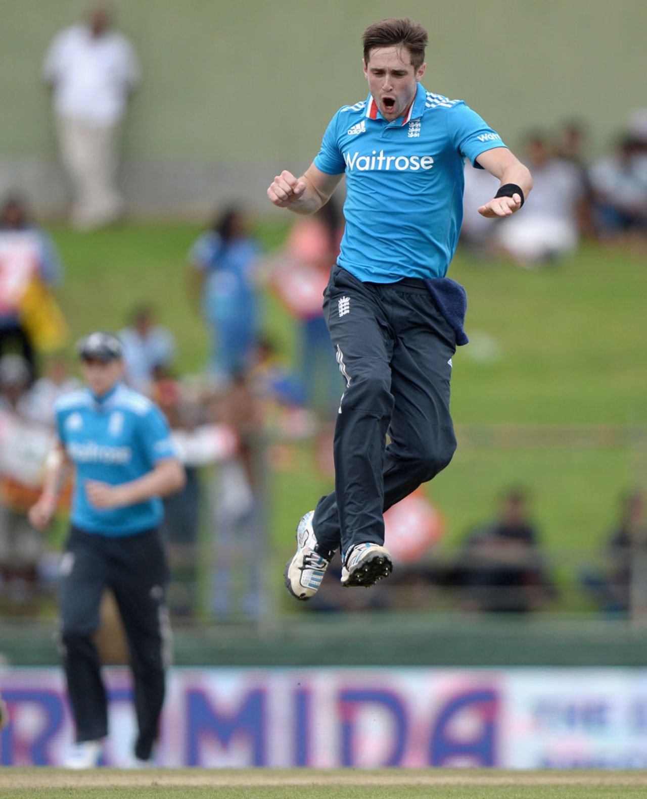 Chris Woakes leaps in joy after a wicket, Sri Lanka v England, 5th ODI, Pallekele, December 10, 2014