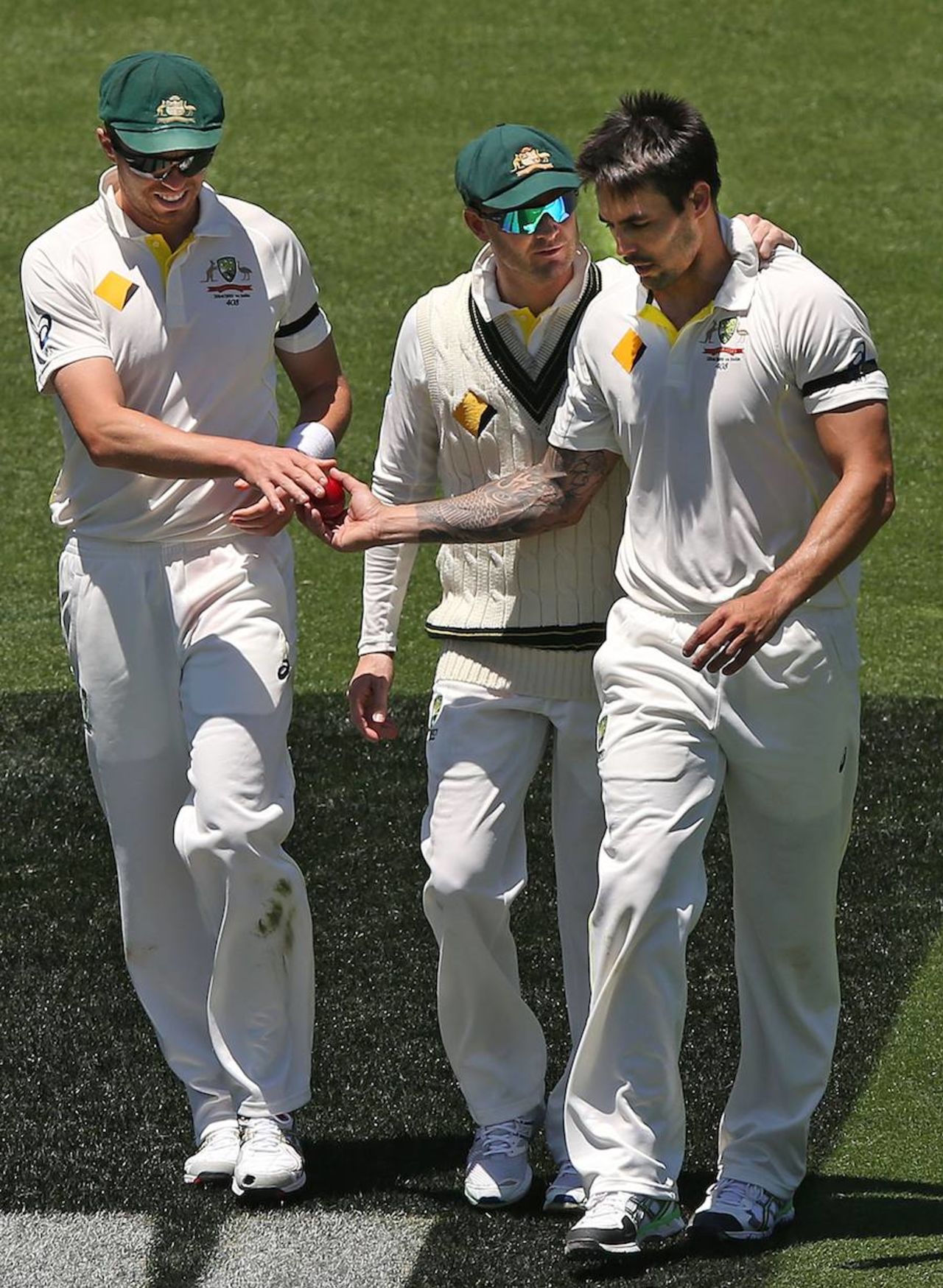 Michael Clarke puts a supportive hand on Mitchell Johnson's shoulder after the bowler appeared shaken when a bouncer struck Virat Kohli's helmet, Australia v India, 1st Test, Adelaide, 3rd day, December 11, 2014
