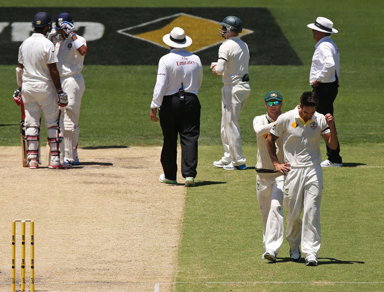 Cheteshwar Pujara and the umpires check on Kohli after a Mitchell Johnson bouncer while Michael Clarke has a word of support for Johnson, Australia v India, 1st Test, Adelaide, 3rd day, December 11, 2014