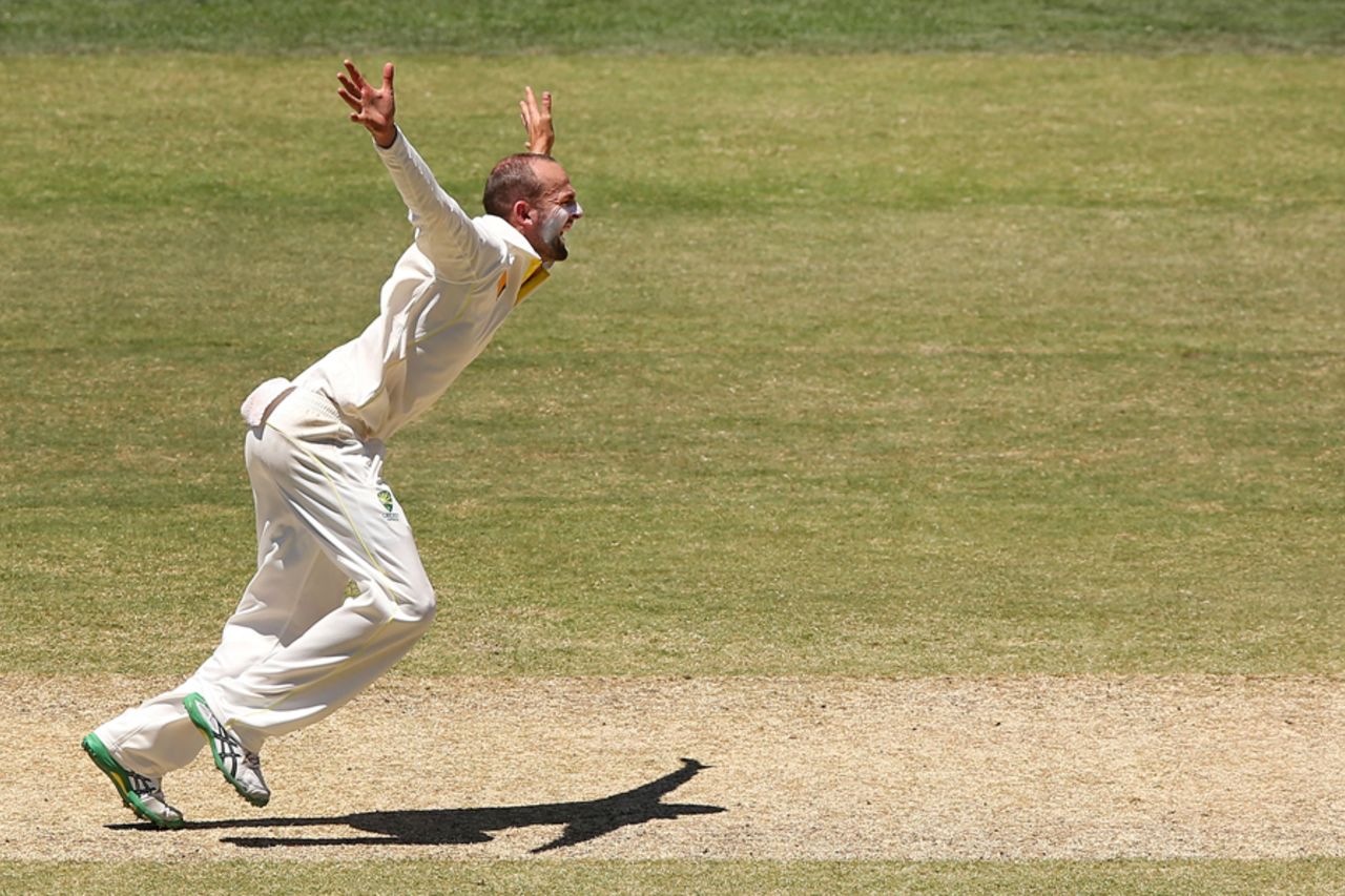 Nathan Lyon puts his all into an appeal, Australia v India, 1st Test, Adelaide, 5th day, December 13, 2014