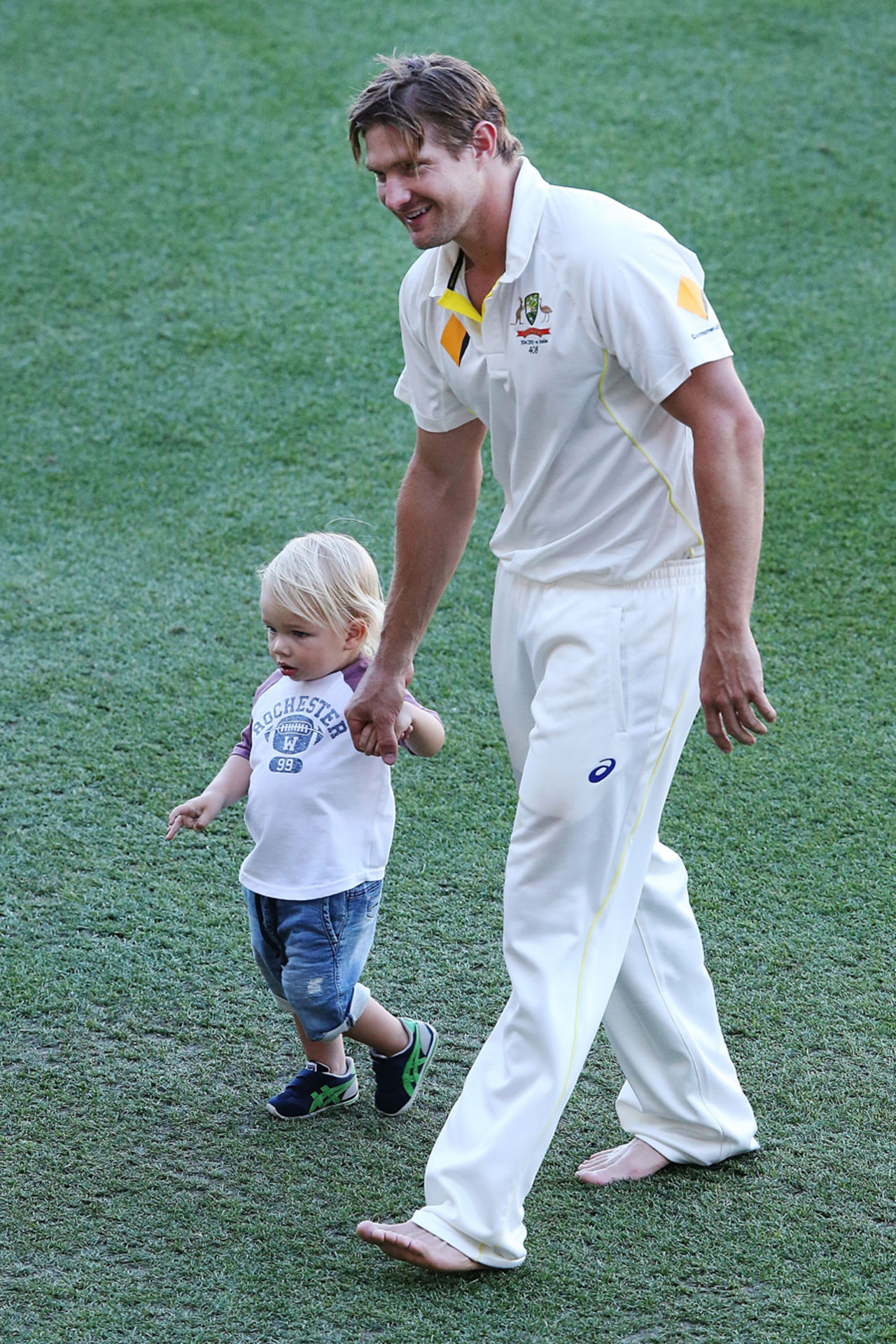 Shane Watson takes a walk with his son Will, after Australia's win, Australia v India, 1st Test, Adelaide, 5th day, December 13, 2014