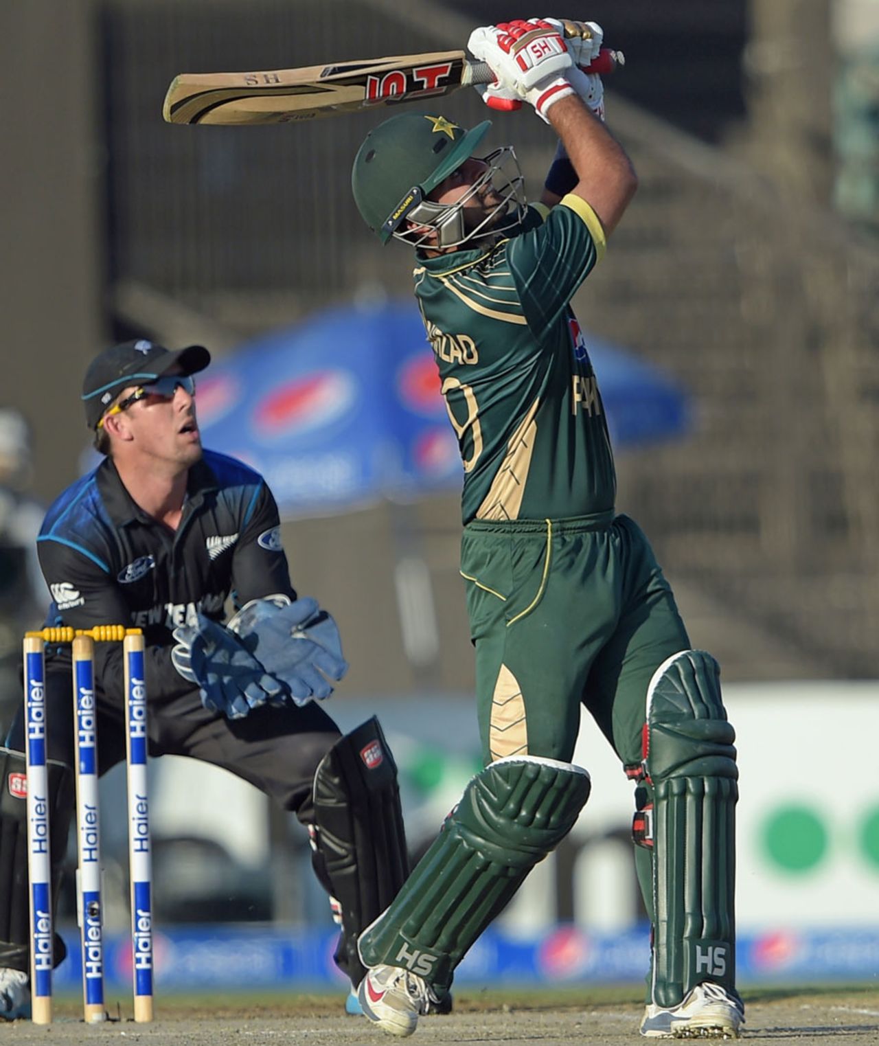 Ahmed Shehzad whacks the ball over the leg side, Pakistan v New Zealand, 3rd ODI, Sharjah, December 14, 2014