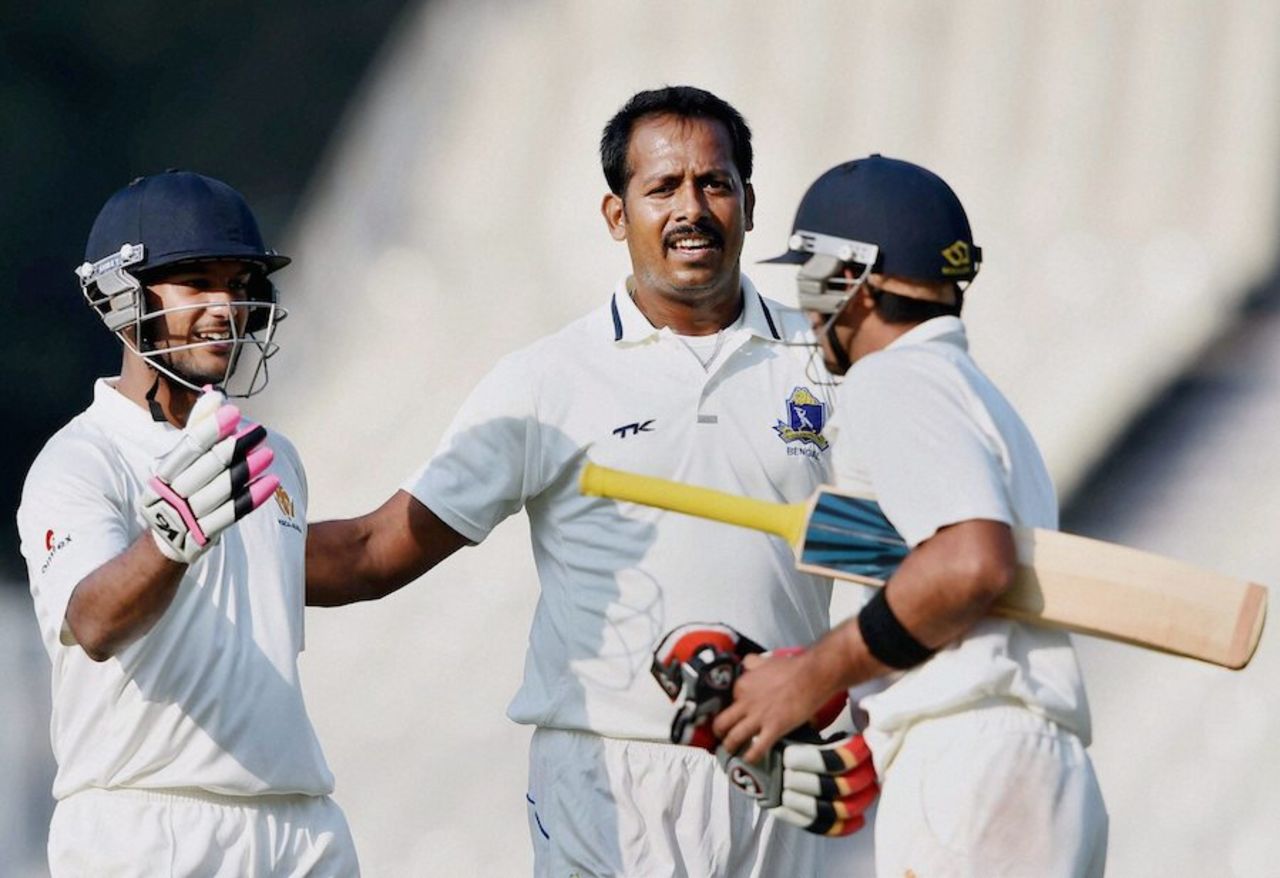 Shib Paul greets the two Karnataka batsmen who sealed the win, Bengal v Karnataka, Ranji Trophy, Group A, 4th day, Kolkata, December 17, 2014