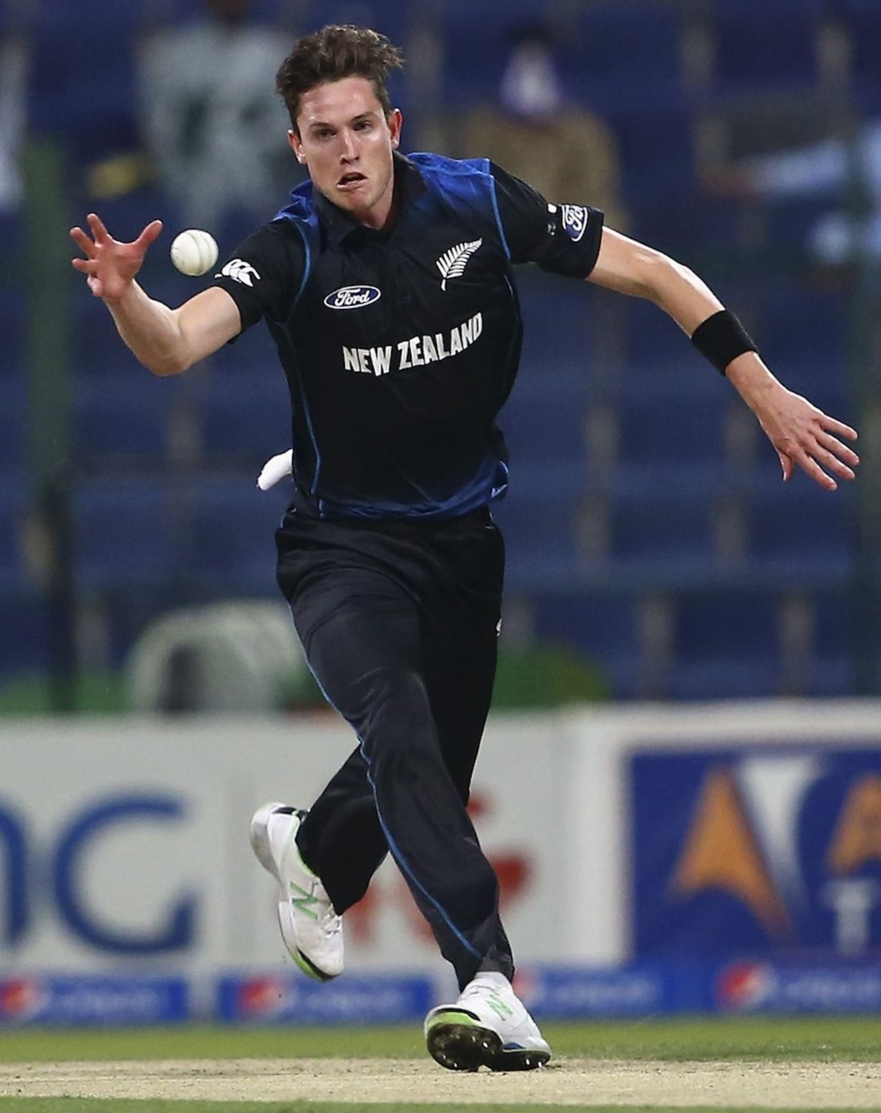 Adam Milne fields in his follow through, Pakistan v New Zealand, 4th ODI, Abu Dhabi, December 17, 2014