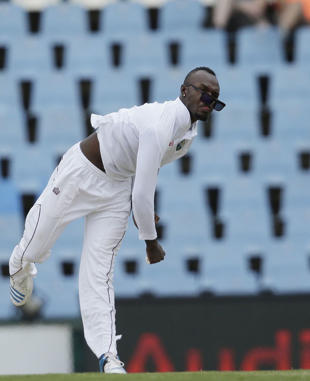 Jermaine Blackwood's sunglasses fall off as he sends down some gentle offspin, South Africa v West Indies, 1st Test, Centurion, 2nd day, December 18, 2014