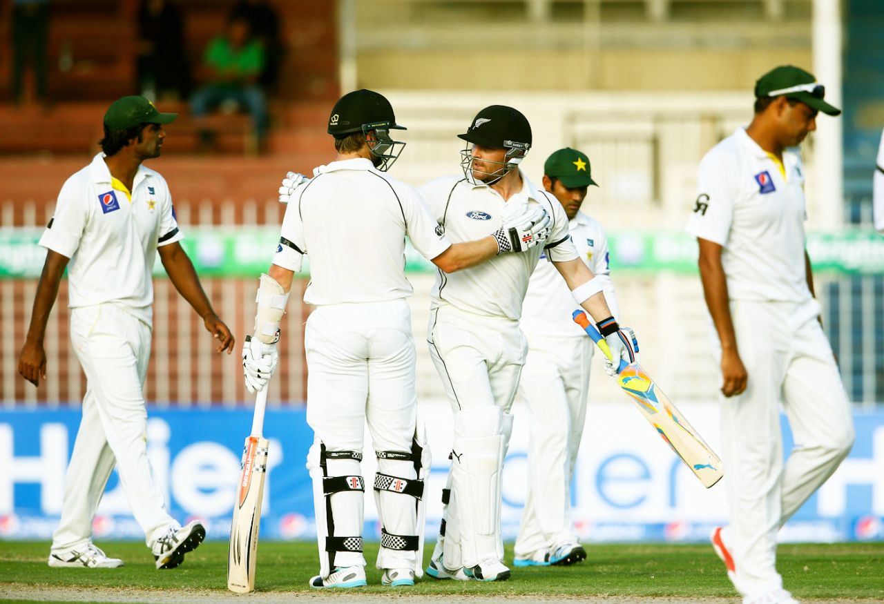 Brendon McCullum is congratulated by Kane Williamson on reaching his hundred, Pakistan v New Zealand, 3rd Test, Sharjah, 2nd day, November 28, 2014