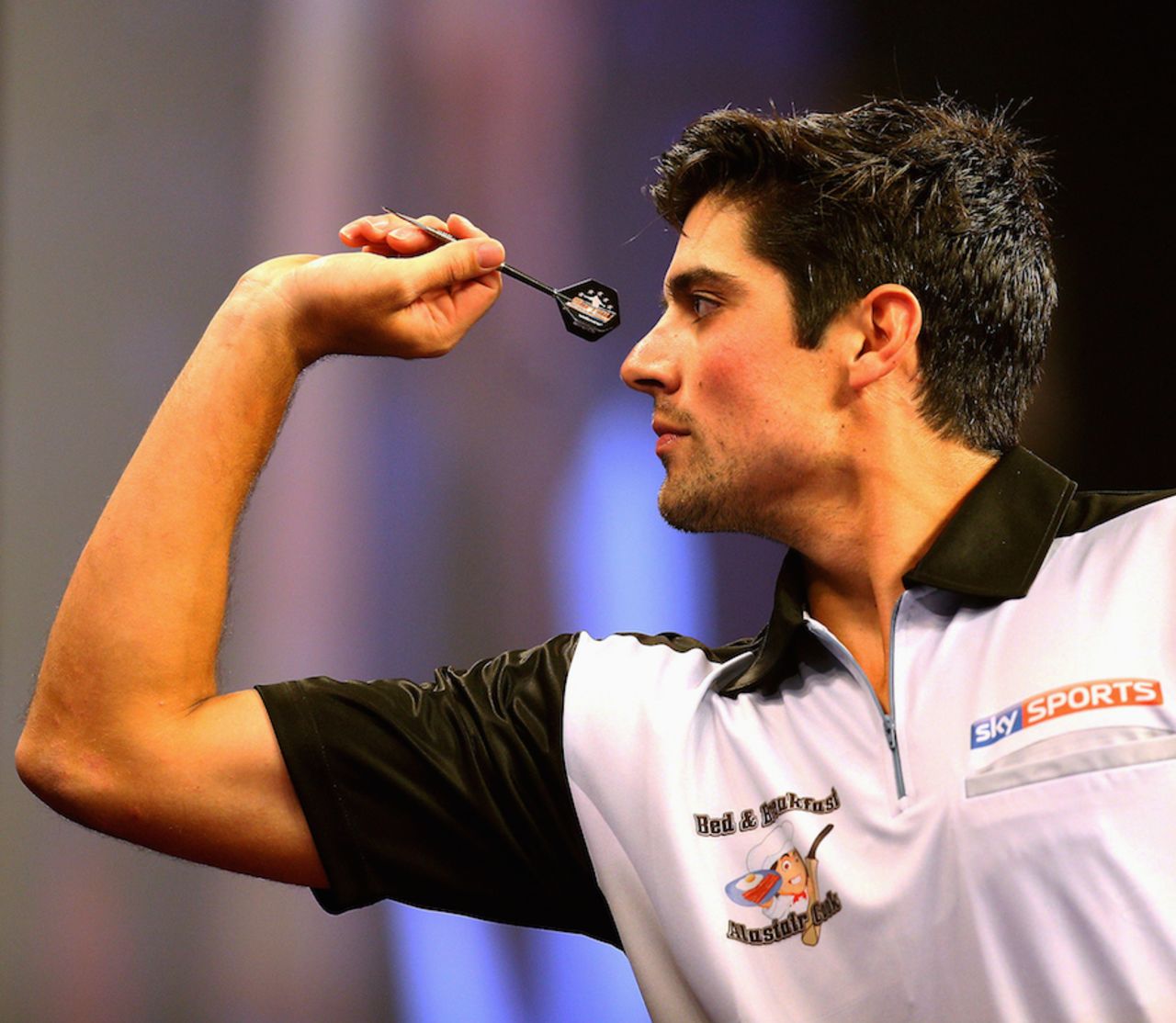 Alastair Cook plays a leg of darts against James Anderson, London, December 22, 2014