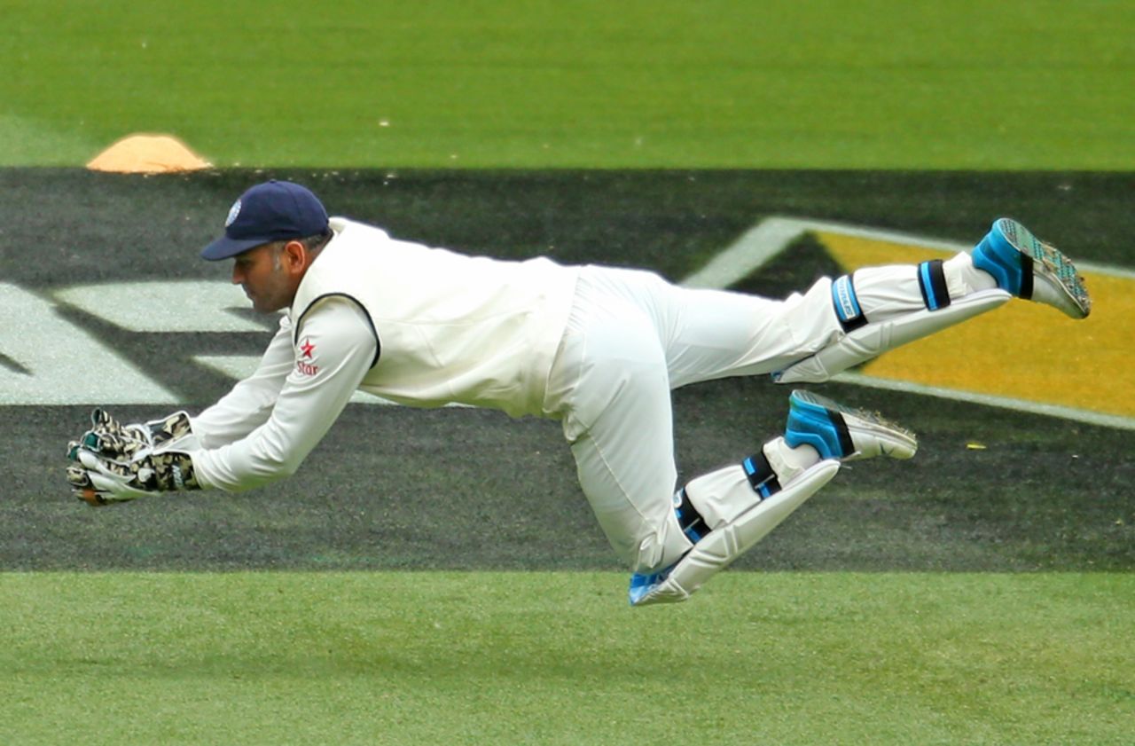 MS Dhoni dives to claim a catch from Joe Burns, Australia v India, 3rd Test, Melbourne, 4th day, December 29, 2014