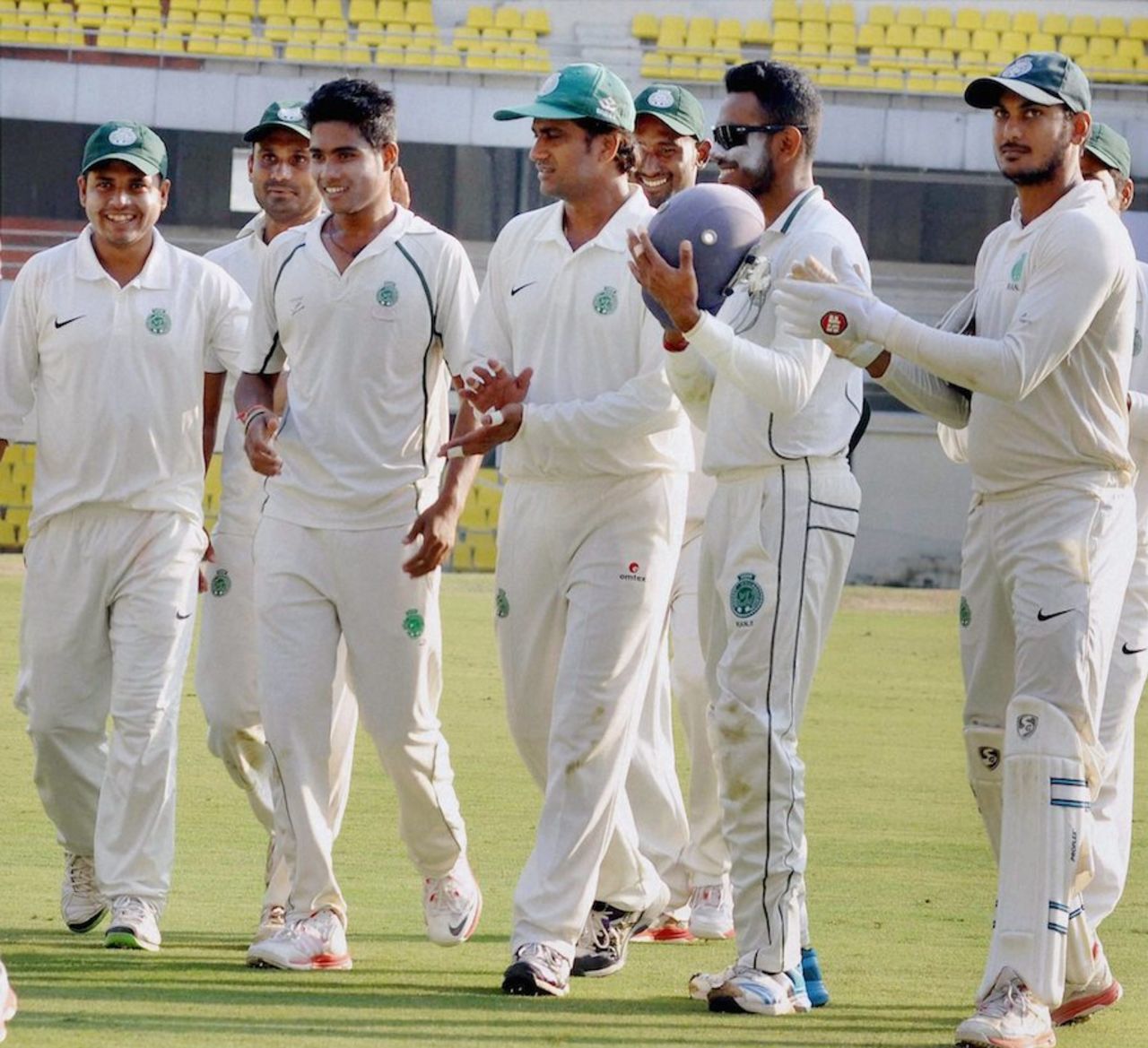 Arup Das (second from left) is cheered by his team-mates for taking four wickets, Assam v Services, Ranji Trophy 2014-15, Group C, Guwahati, January 5, 2015