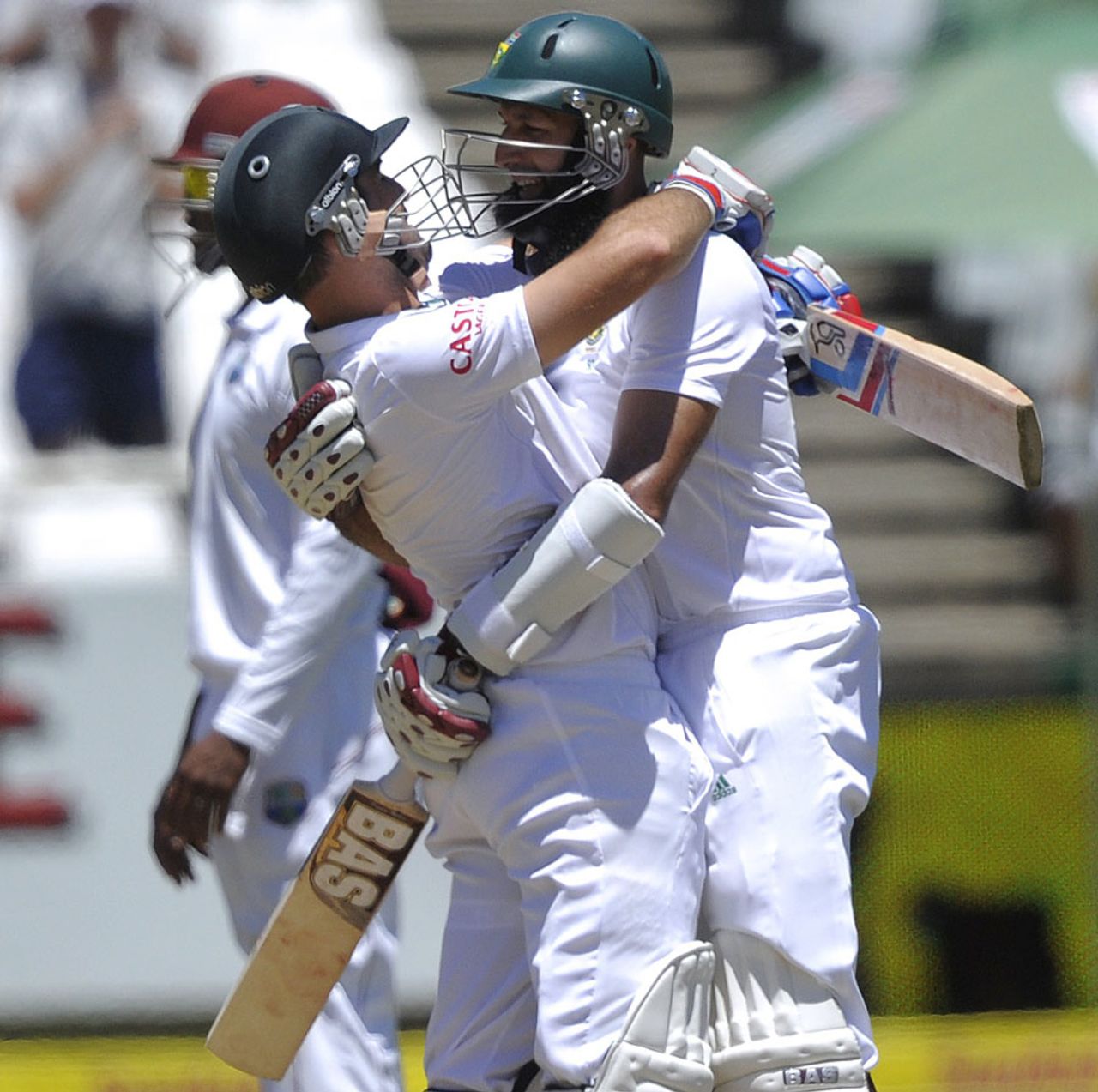 Dean Elgar and Hashim Amla embrace as they secure victory, South Africa v West Indies, 3rd Test, Cape Town, 5th day, January 6, 2014