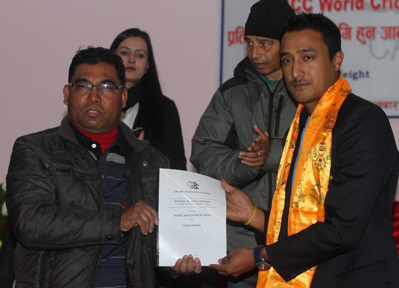 Paras Khadka with the new central contract for Nepal players, Kathmandu, January 6, 2014
