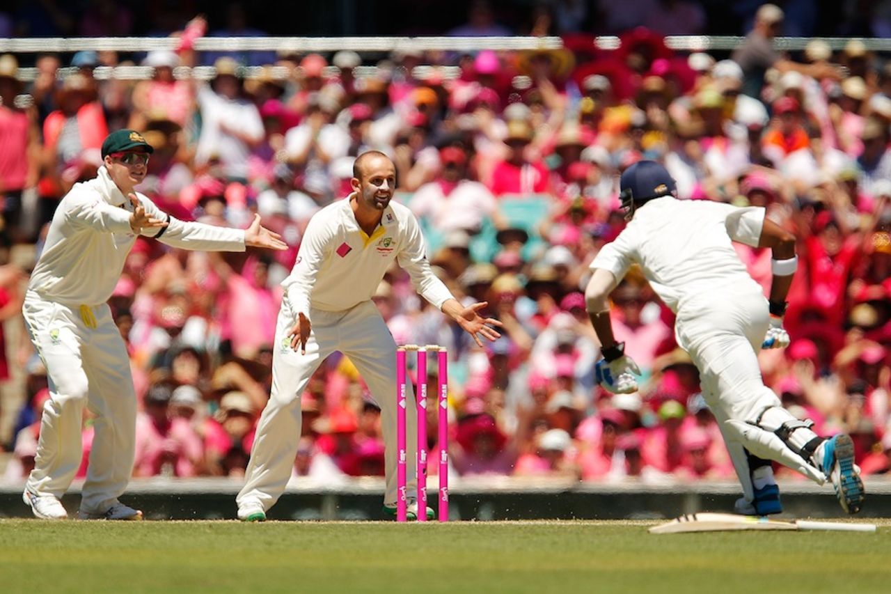 KL Rahul scrambles to get back into his crease as Steven Smith and Nathan Lyon wait for the ball, Australia v India, 4th Test, Sydney, 3rd day, January 8, 2015