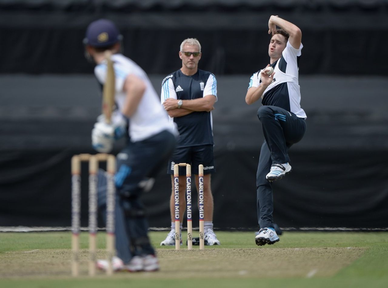 Peter Moores umpires as Chris Woakes bowls during a match simulation, Canberra, January 10, 2015