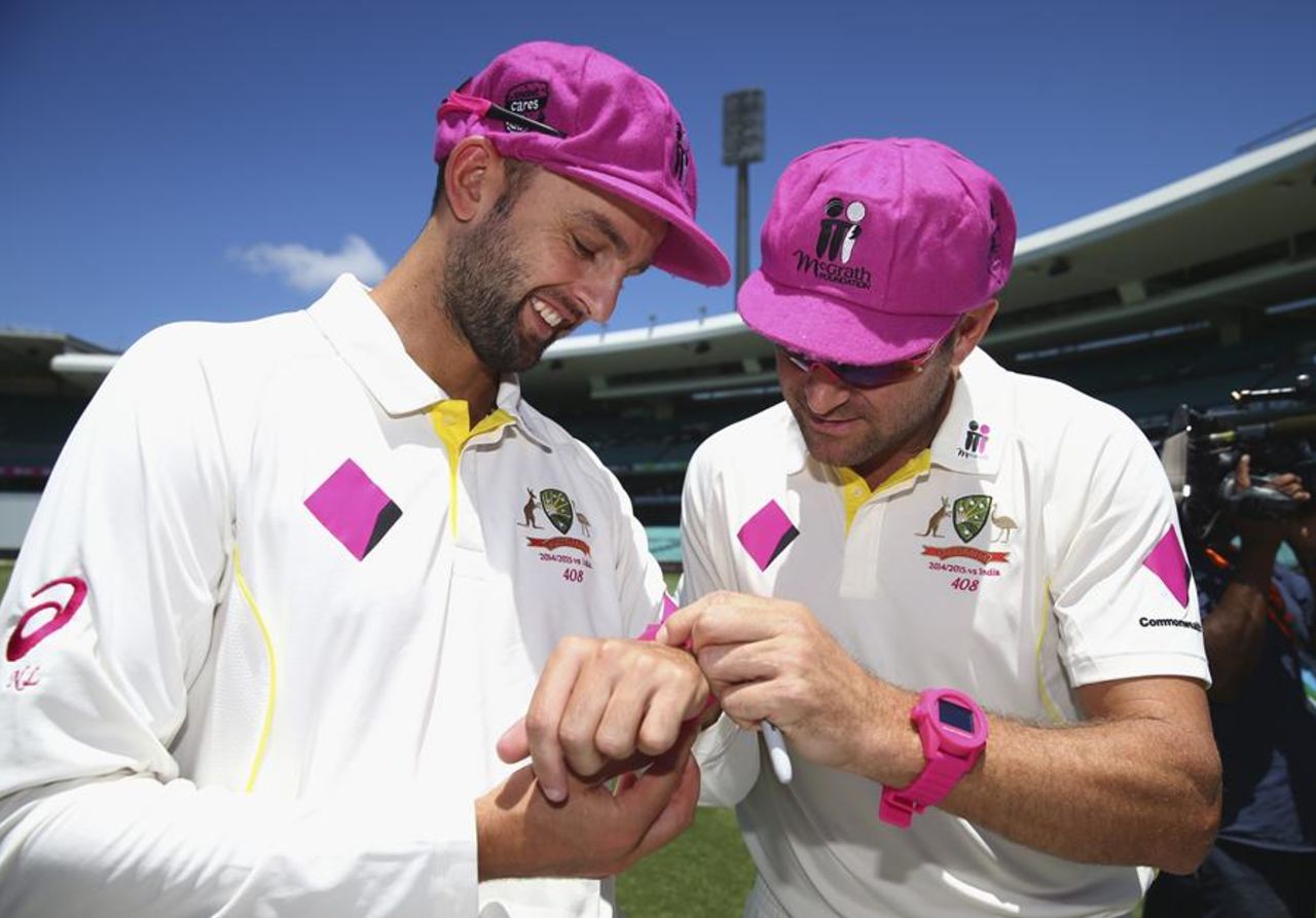 Nathan Lyon and Ryan Harris with their pink accessories, Sydney, January 3, 2015