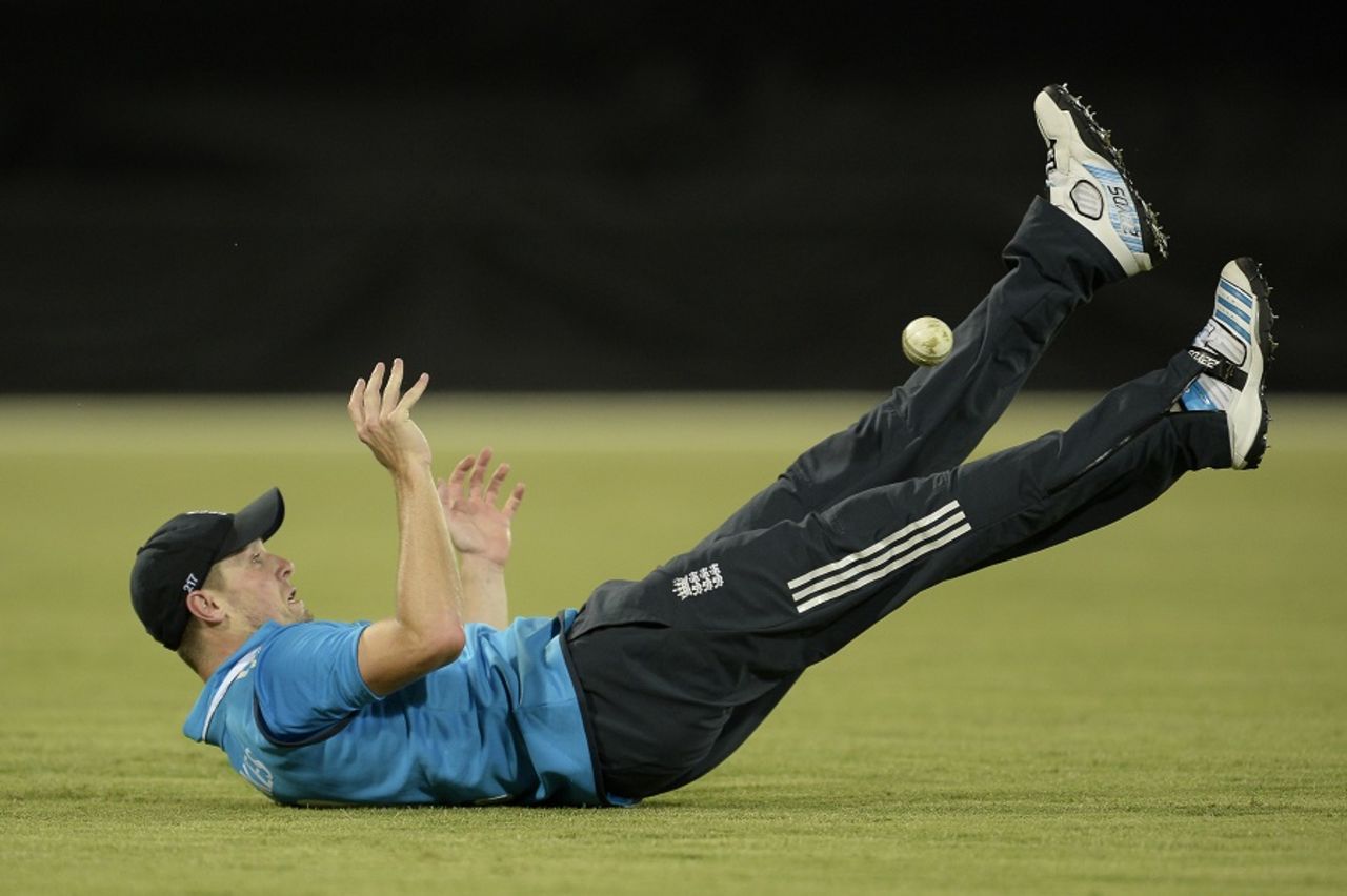 Footy fun: Chris Woakes manages to hold on to a catch after juggling it off his legs, England XI v Prime Minister's XI, Canberra, January 14, 2015