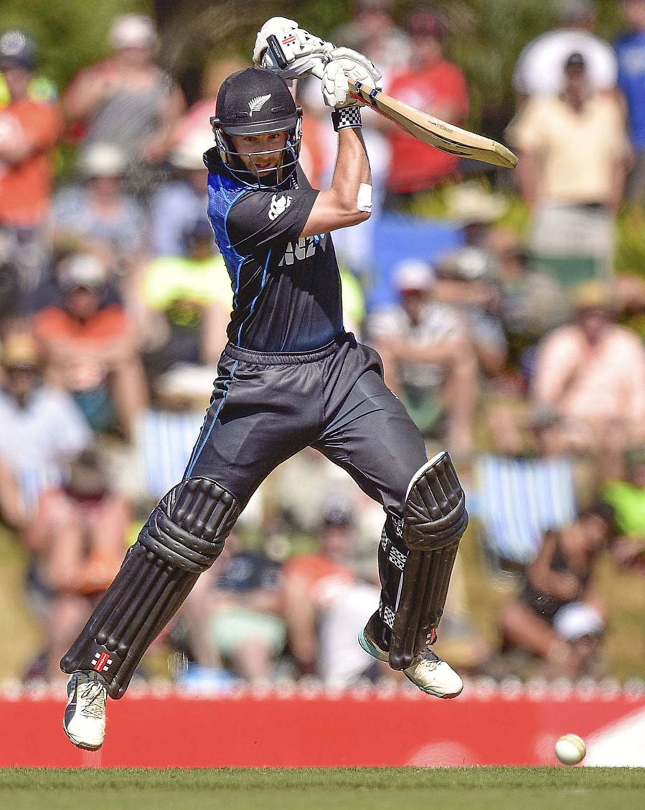 Kane Williamson gets off the ground as he punches the ball through the off, New Zealand v Sri Lanka, 4th ODI, Nelson, January 20, 2015