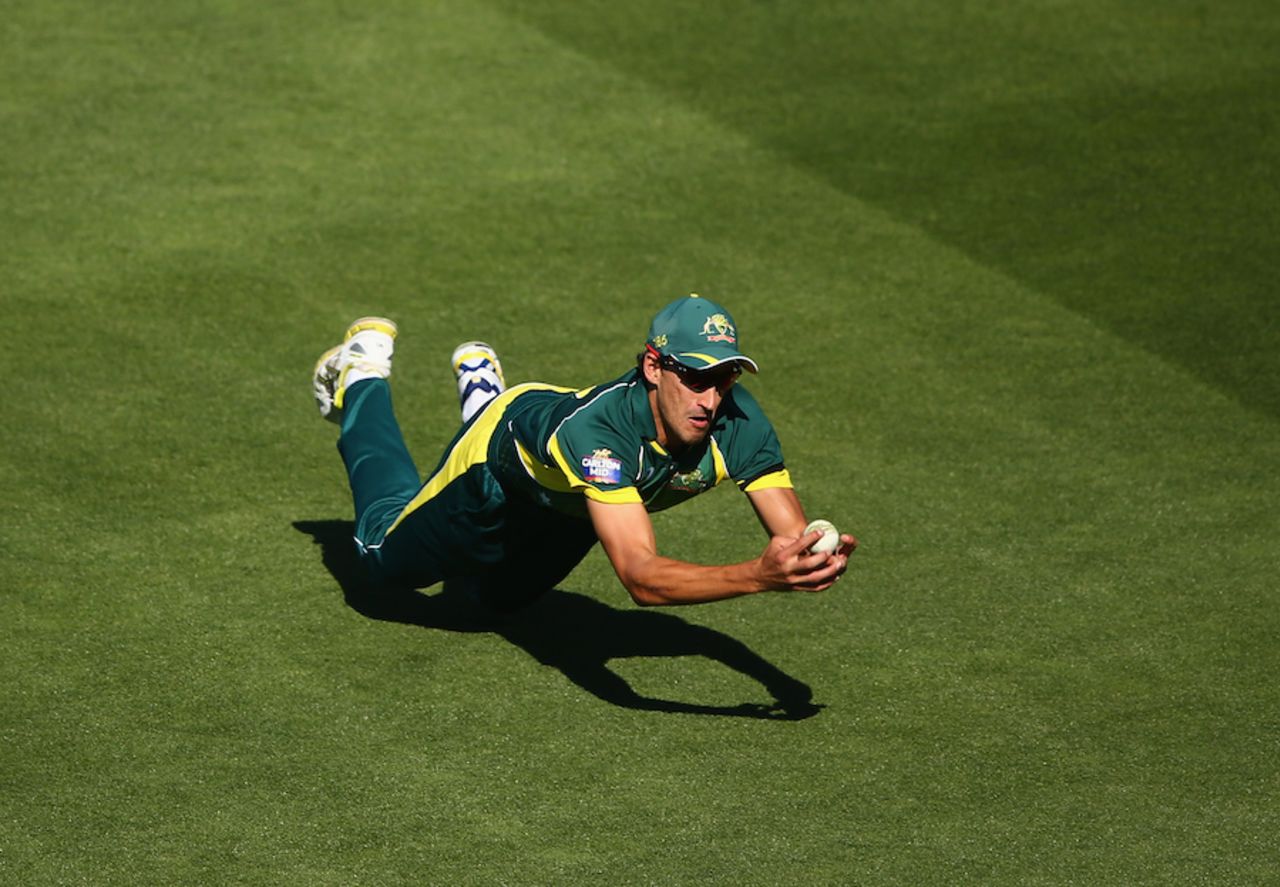 Mitchell Starc took a sharp catch at mid-off to dismiss Ian Bell, Australia v England, Carlton Mid Tri-Series, Hobart, January 23, 2015