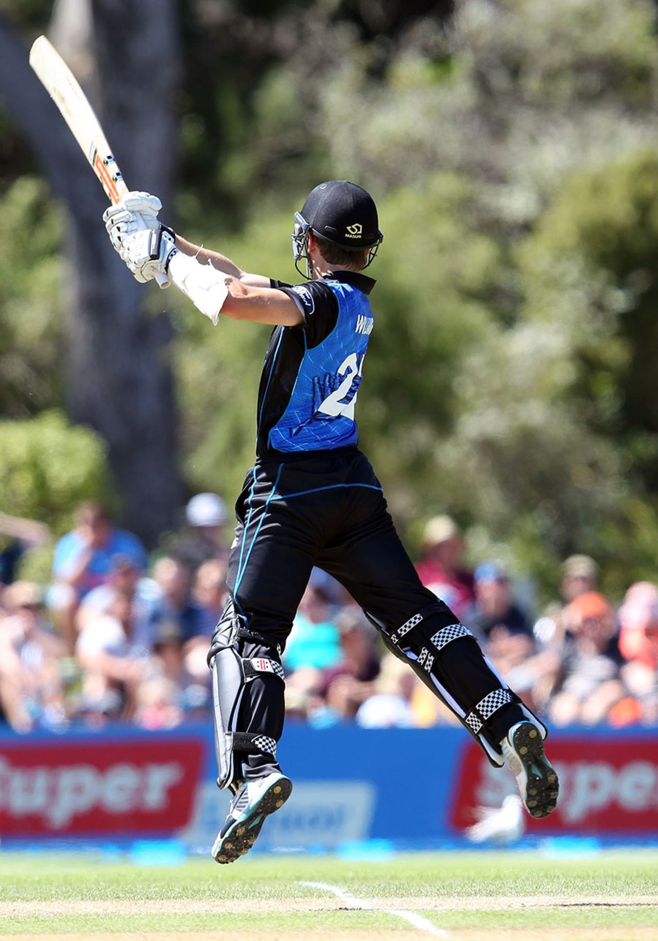 An airborne Kane Williamson slaps the ball through the off side, New Zealand v Sri Lanka, 6th ODI, Dunedin, January 25, 2015