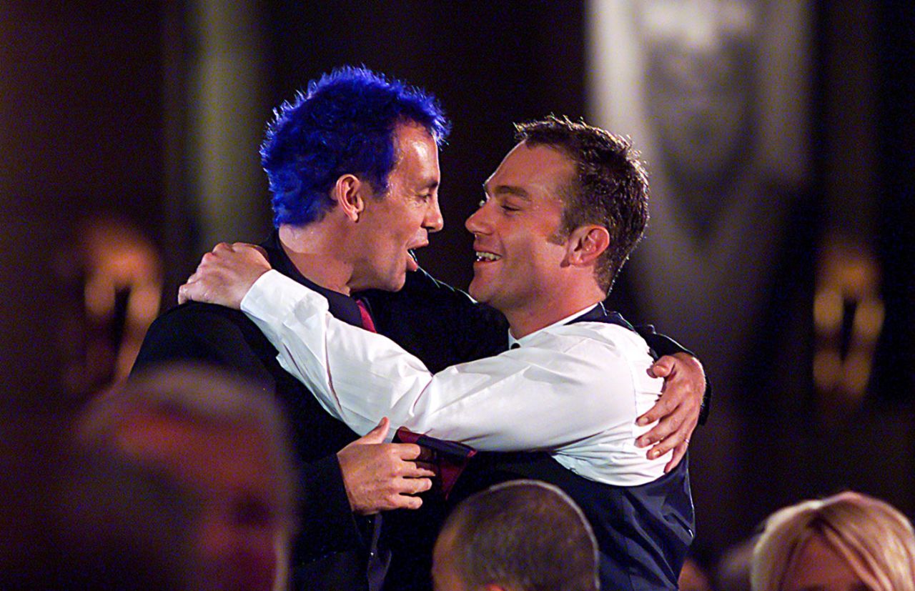 Colin Miller and Michael Slater embrace after Miller won the Australian Test Player of the Year at the Allan Border Medal Presentation held at Crown Casino in Melbourne, February 12, 2002