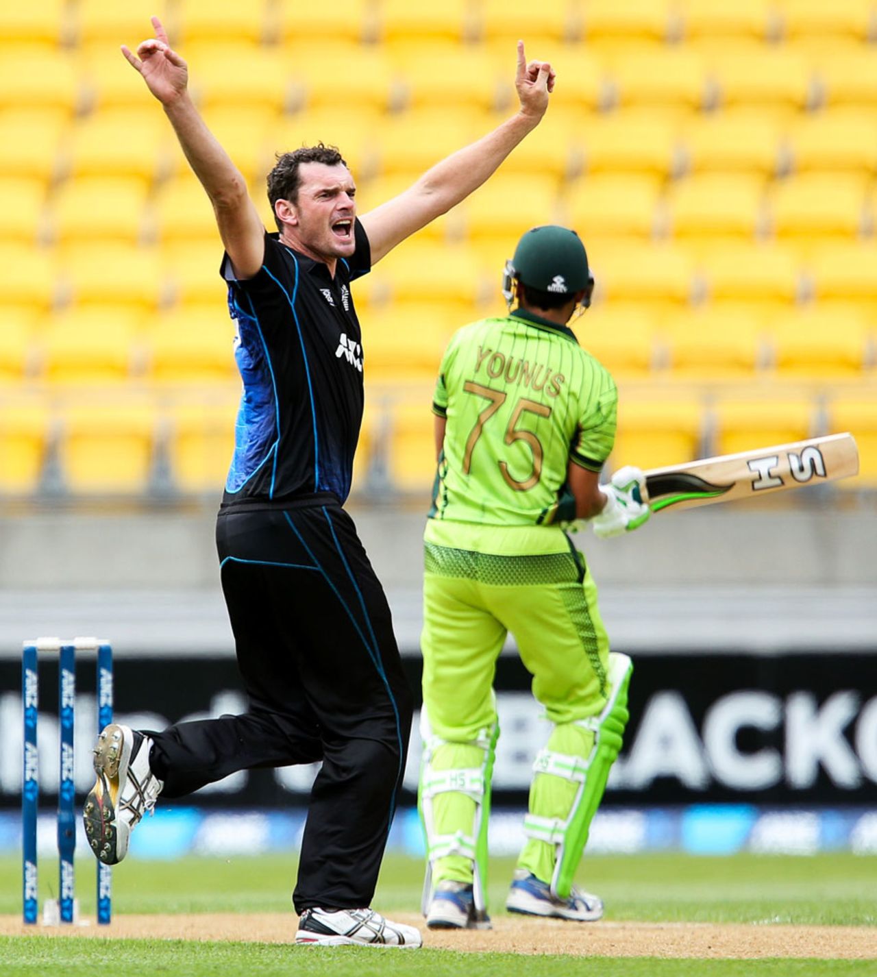 A jubilant Kyle Mills wheels away after trapping Younis Khan lbw, New Zealand v Pakistan, 1st ODI, Wellington, January 31, 2015