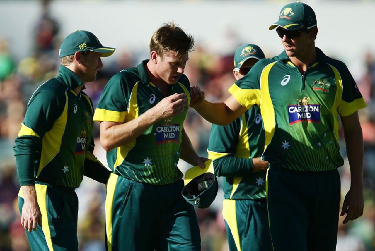 A dejected James Faulkner leaves the field after suffering an injury, Australia v England, Carlton Mid Tri-series final, Perth, February 1, 2015