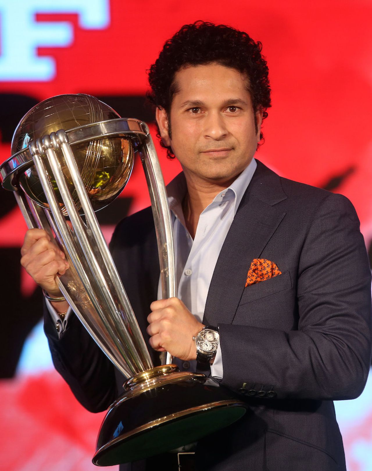 Sachin Tendulkar holds the World Cup trophy at a promotional event, Mumbai, February 7, 2015