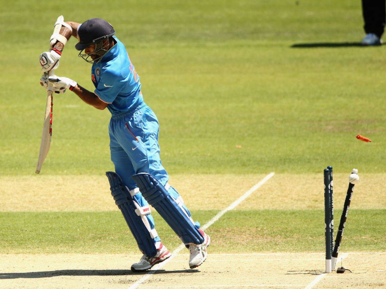 Shikhar Dhawan is bowled by Hamid Hassan, Afghanistan v India, World Cup warm-ups, Adelaide, February 10, 2015