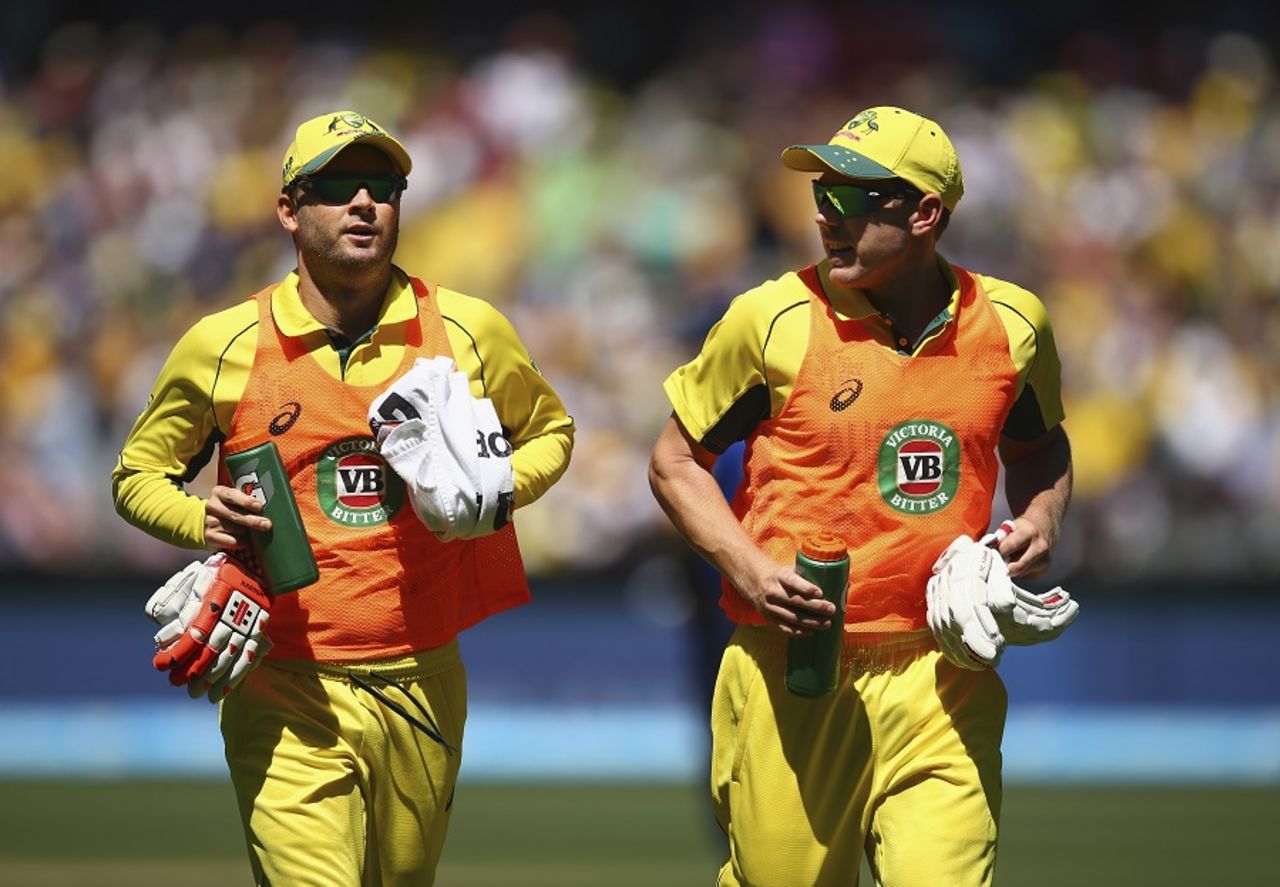 Michael Clarke and James Faulkner help out with the drinks, Australia v England, Group A, World Cup 2015, Melbourne, February 14, 2015