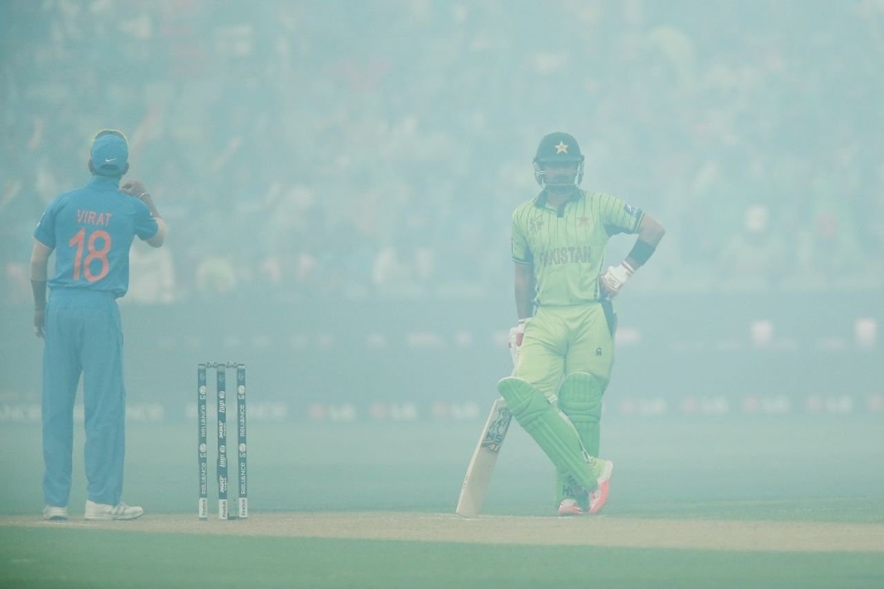 Ahmed Shehzad and Virat Kohli wait for the smoke to clear, India v Pakistan, World Cup 2015, Group B, Adelaide, February 15, 2015  
