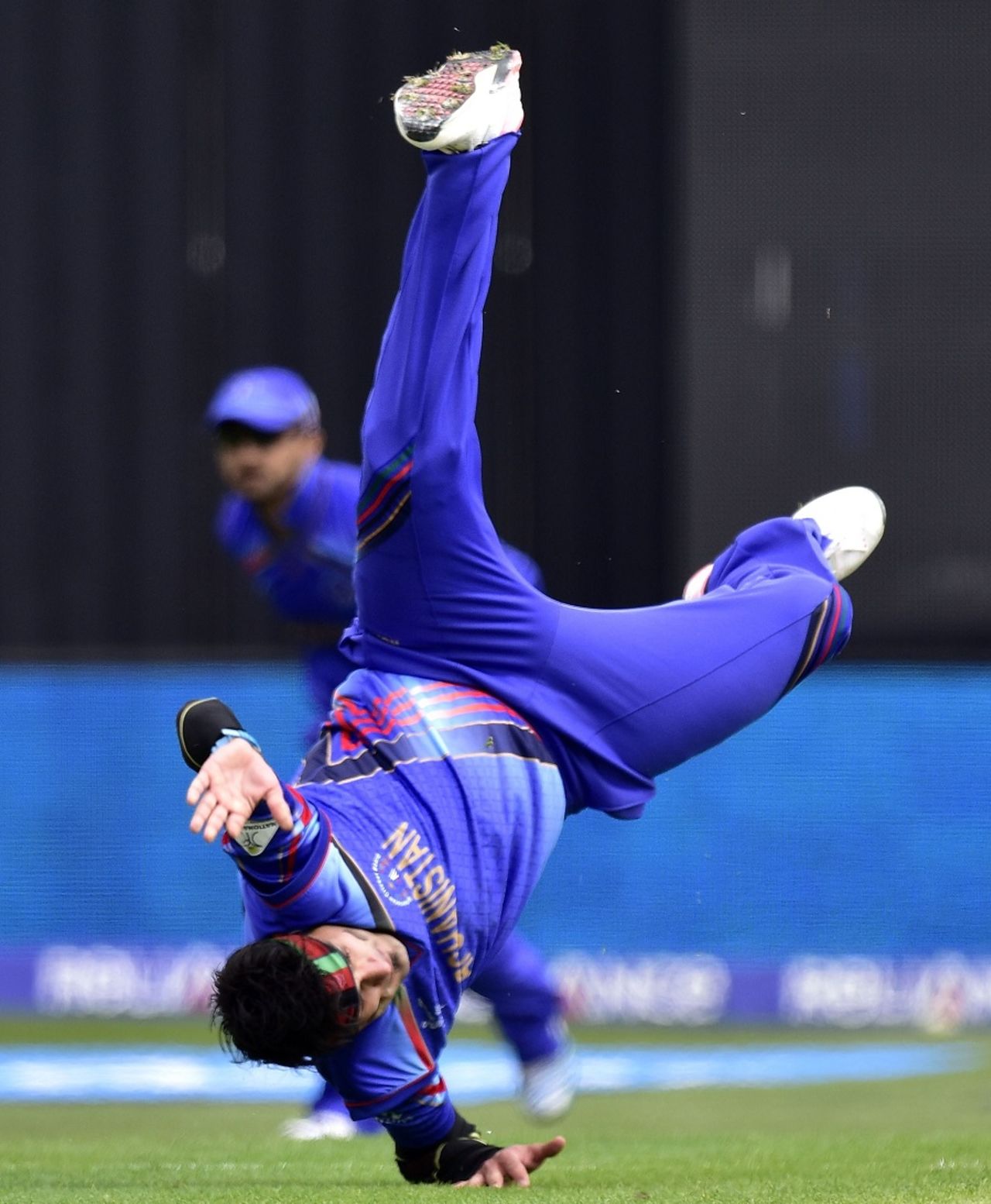 Hamid Hassan attempts a cartwheel after bowling Kumar Sangakkara, Afghanistan v Sri Lanka, World Cup 2015, Group A