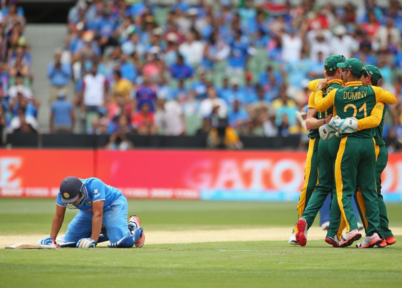 Down and out: Rohit Sharma stumbled and was caught short by a direct hit, India v South Africa, World Cup 2015, Group B, Melbourne, February 22, 2015