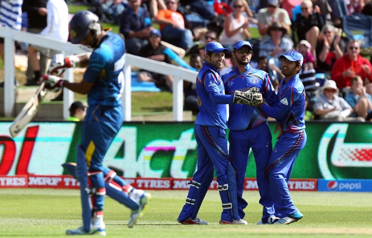Afghanistan fielders rejoice after dismissing Dimuth Karunaratne, Afghanistan v Sri Lanka, World Cup 2015, Group A