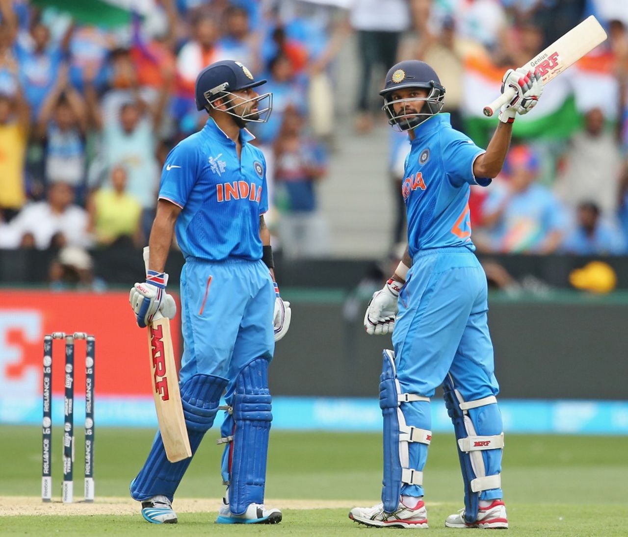 Shikhar Dhawan raises his bat after reaching a fifty as Virat Kohli looks on, India v South Africa, World Cup 2015, Group B, Melbourne, February 22, 2015