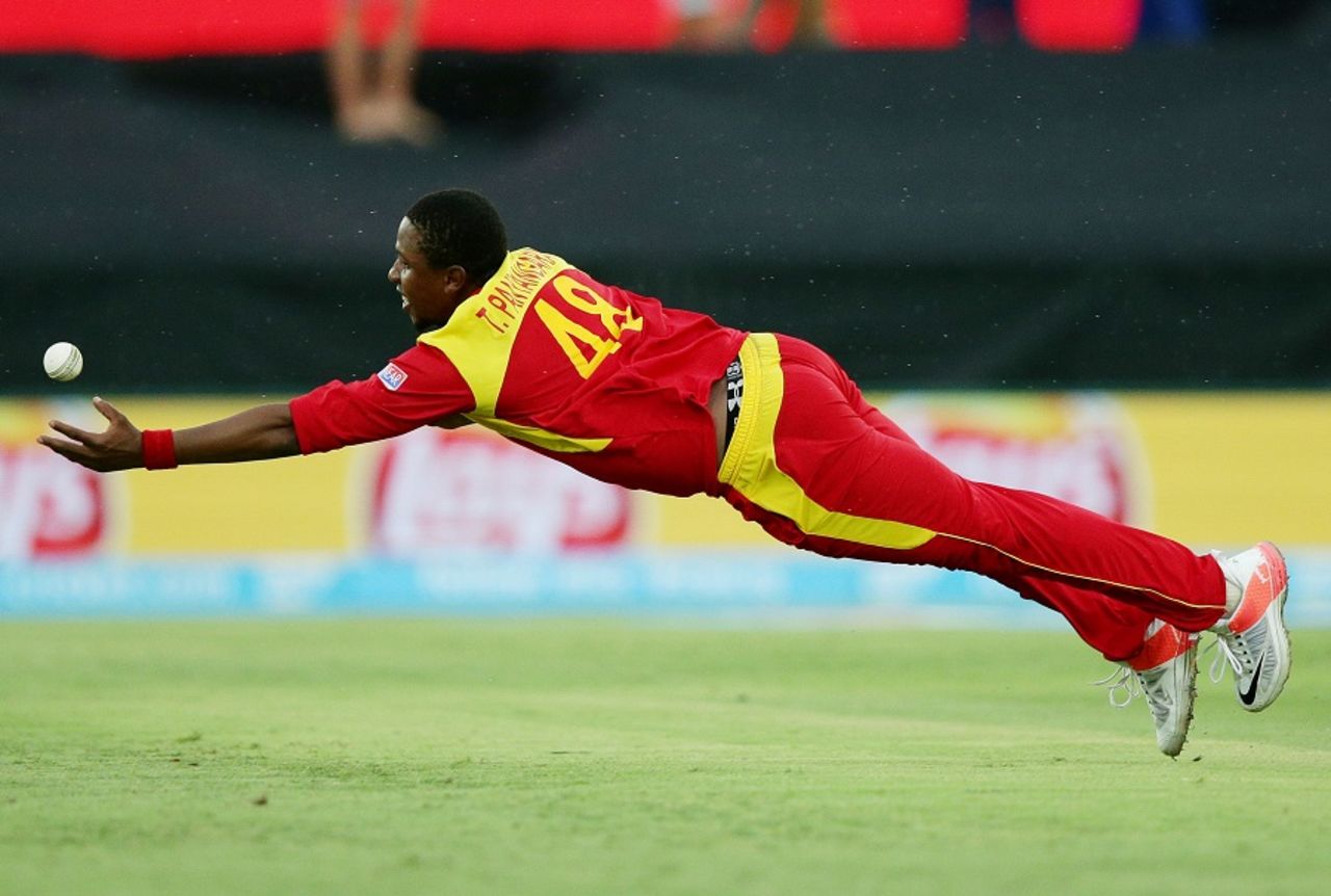 Tinashe Panyangara dives in an attempt to pull off a catch, West Indies v Zimbabwe, World Cup 2015, Group B, Canberra, February 24, 2015